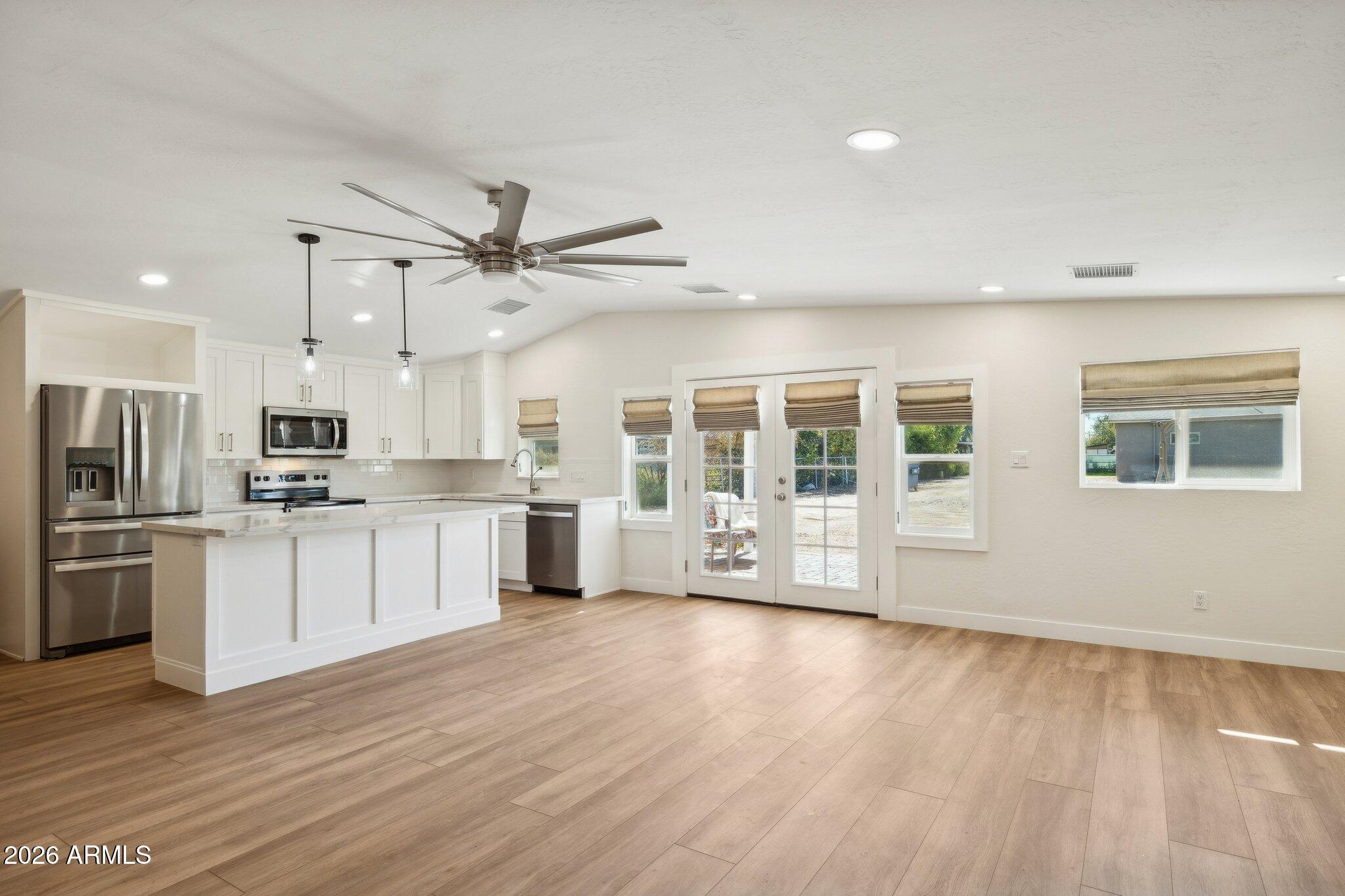 16226 East Fairview Street Gilbert, AZ 85295 - Photo 39 of 59 a view of kitchen with stainless steel appliances refrigerator oven and stove