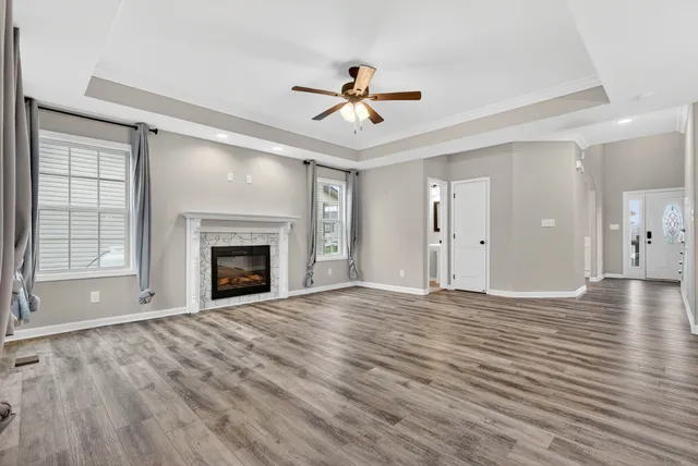 a view of a kitchen with a sink and a refrigerator