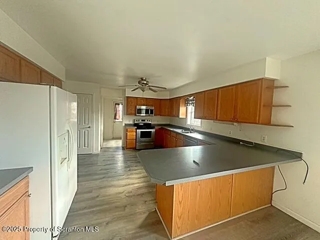 a view of hallway with wooden floor
