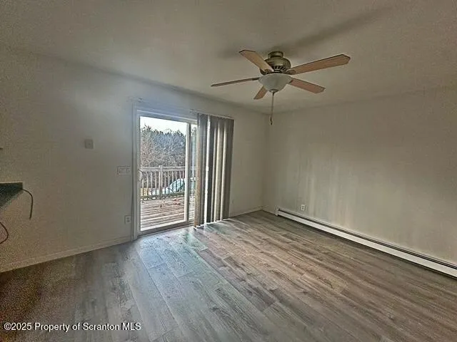 a bathroom with a glass door shower and sink