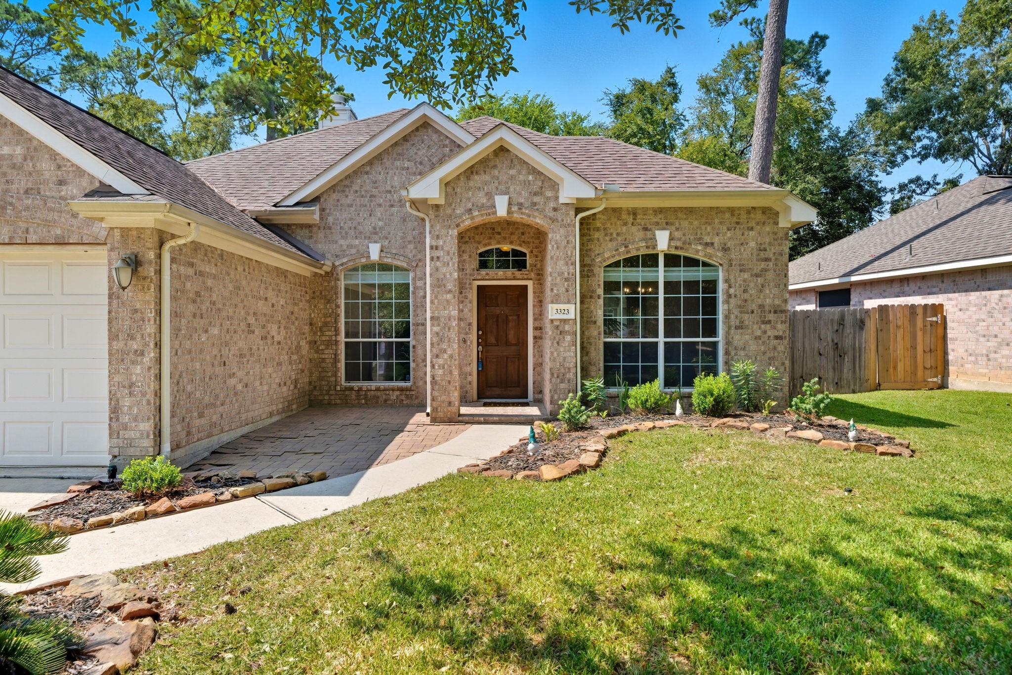 a front view of a house with a yard and porch