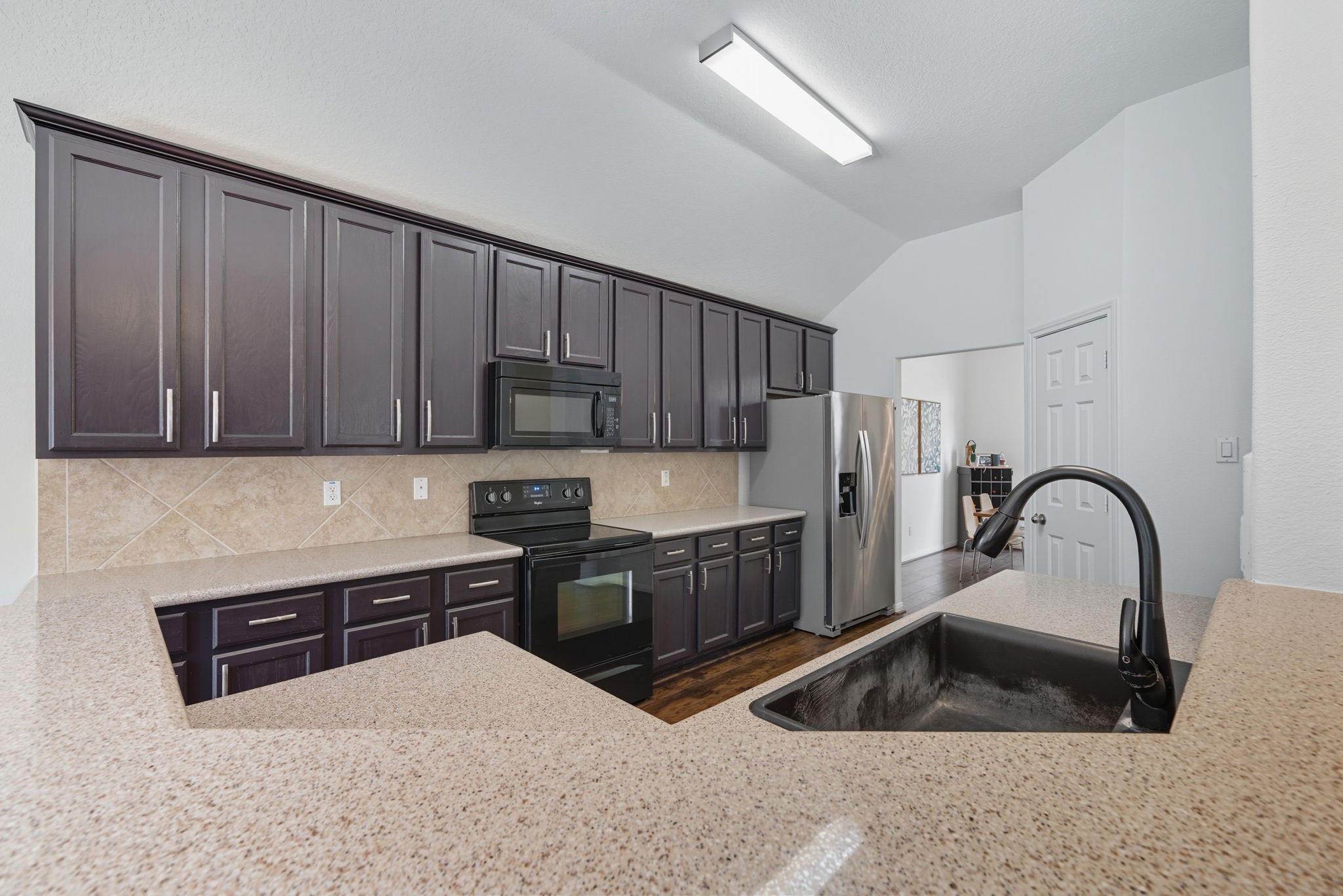 3323 Rollingwood Montgomery, TX 77356 - Photo 12 of 43 a kitchen with a sink cabinets and appliances