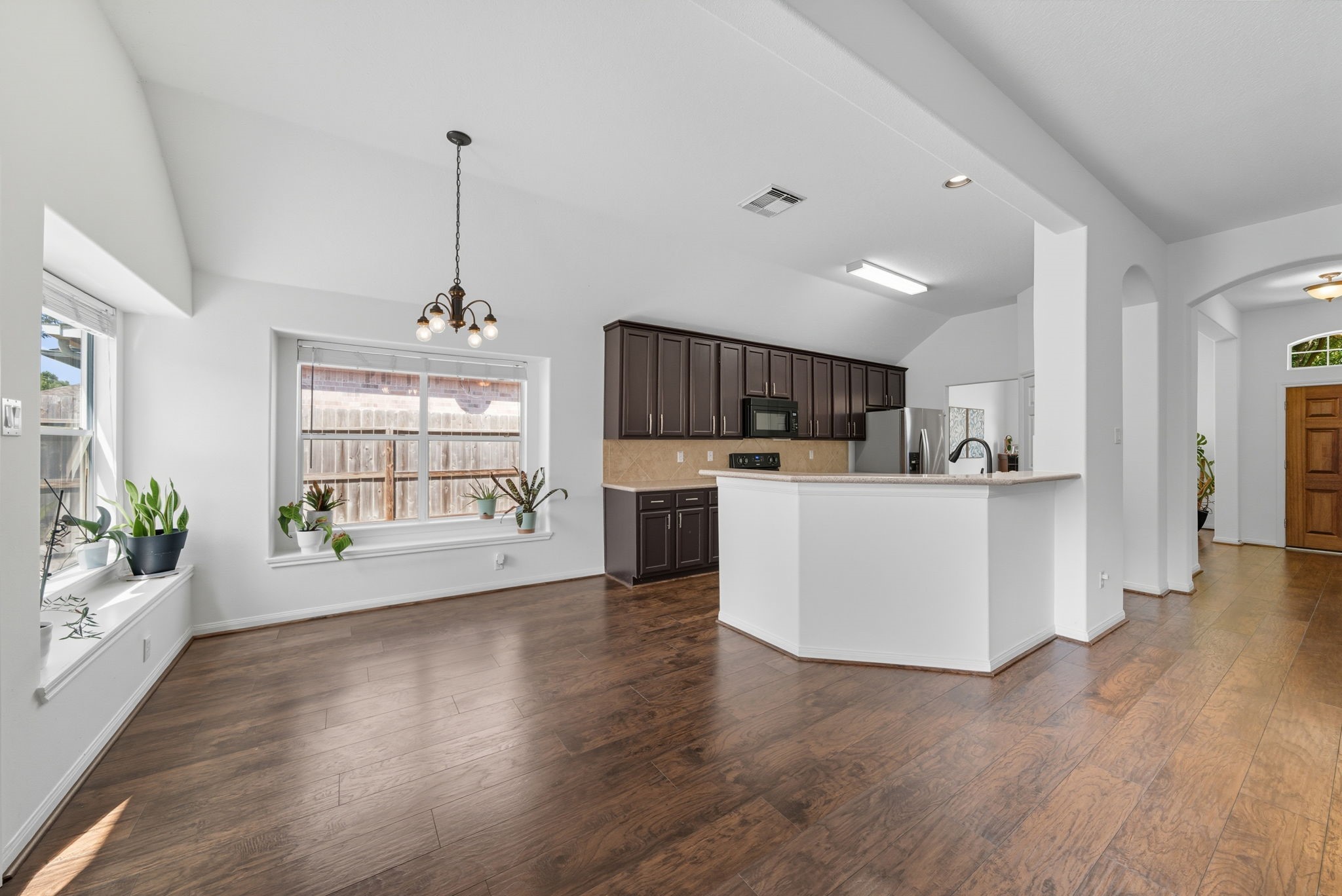 3323 Rollingwood Montgomery, TX 77356 - Photo 18 of 43 a view of a kitchen with sink and wooden floor