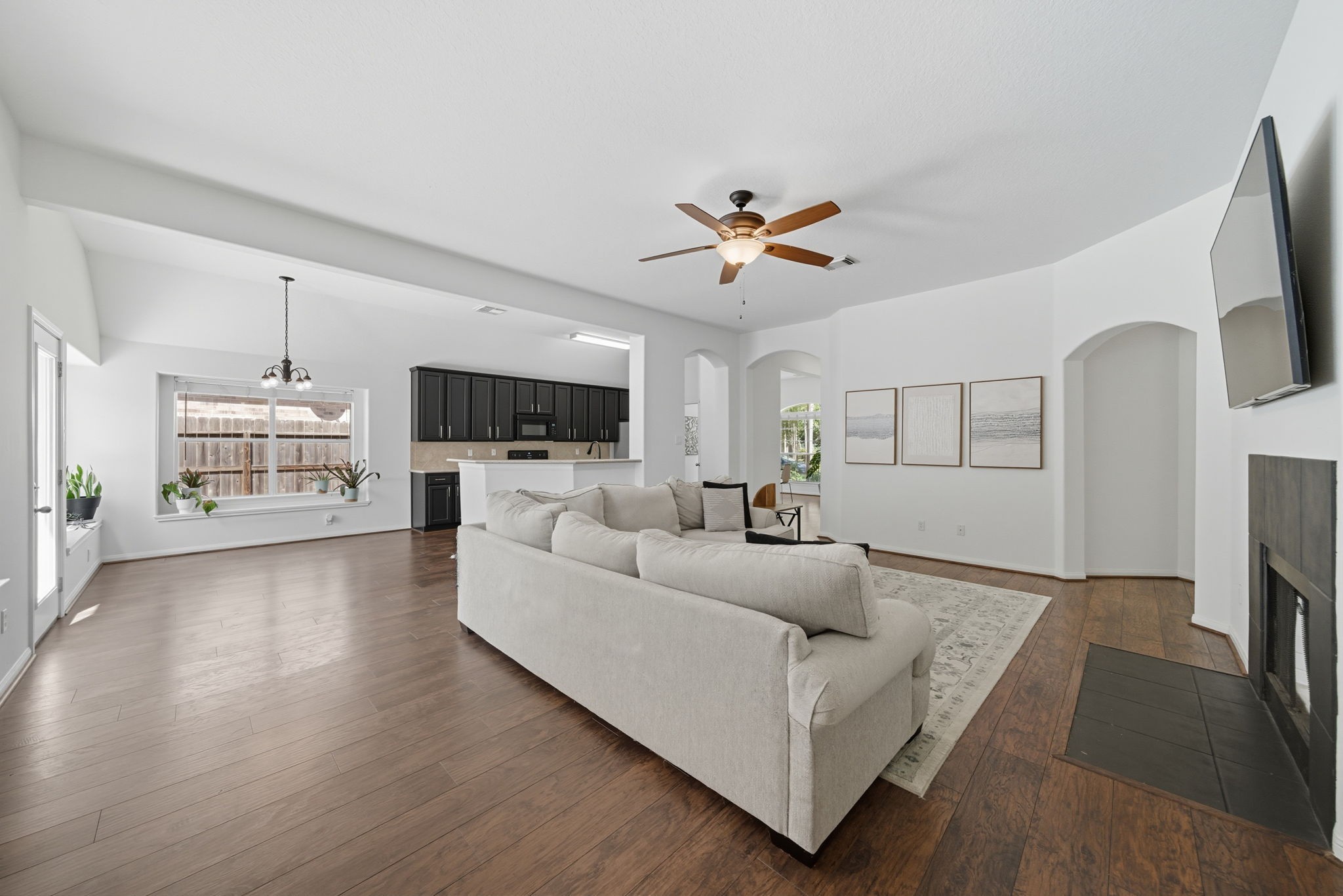 3323 Rollingwood Montgomery, TX 77356 - Photo 21 of 43 a living room with furniture a fireplace and a flat screen tv