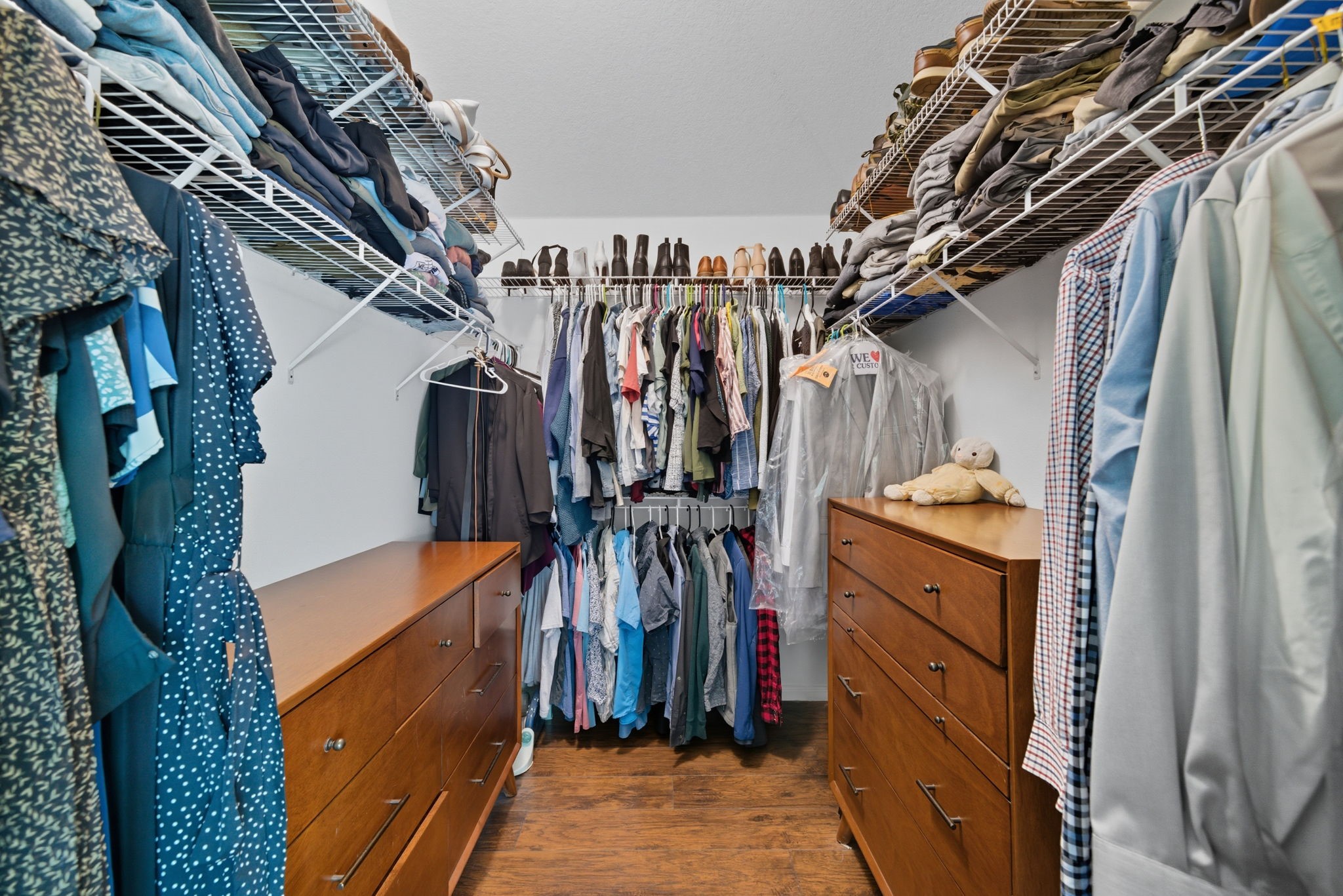 3323 Rollingwood Montgomery, TX 77356 - Photo 27 of 43 a view of walk in closet with clothes and shoes