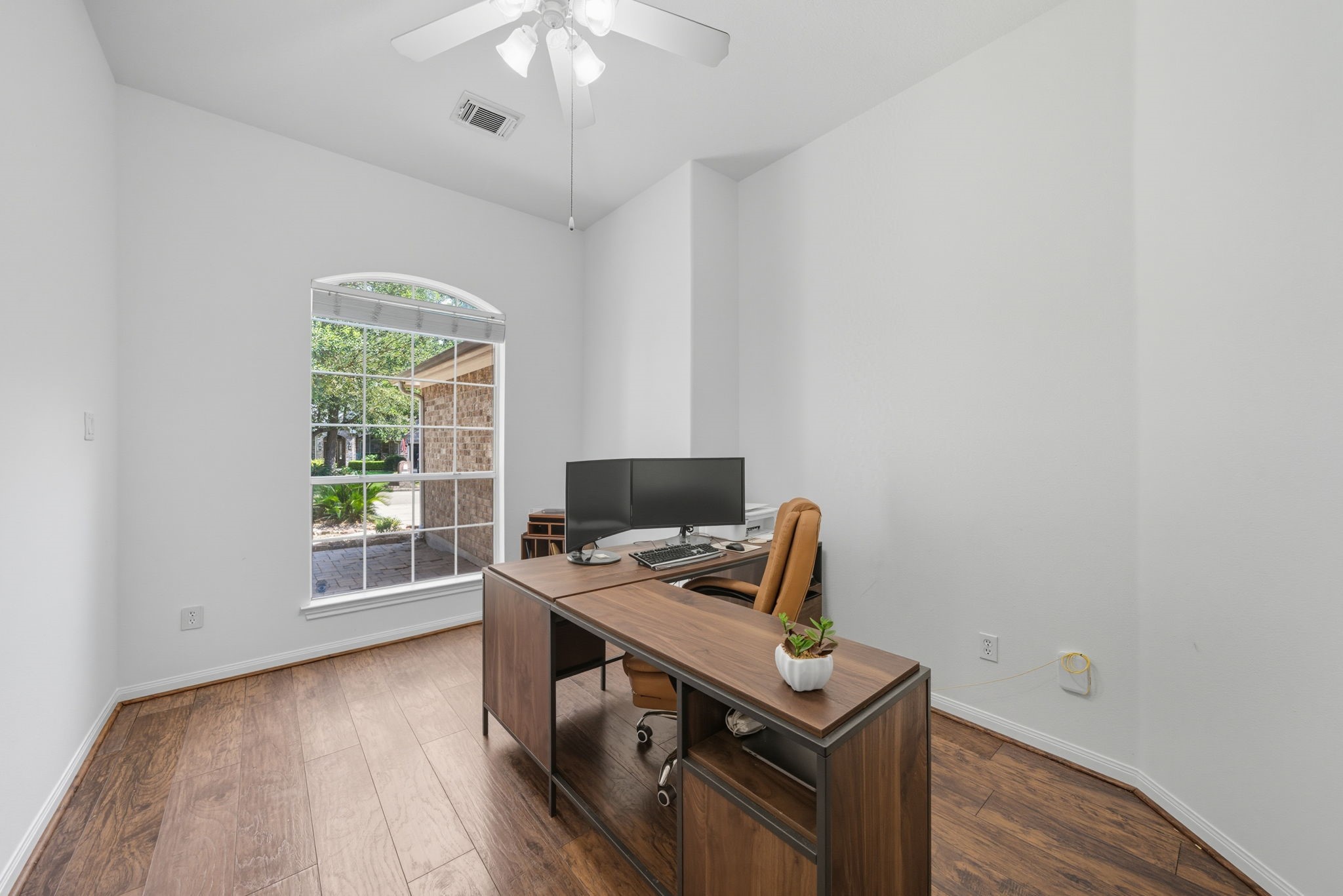 3323 Rollingwood Montgomery, TX 77356 - Photo 5 of 43 a view of a workspace with furniture and a window