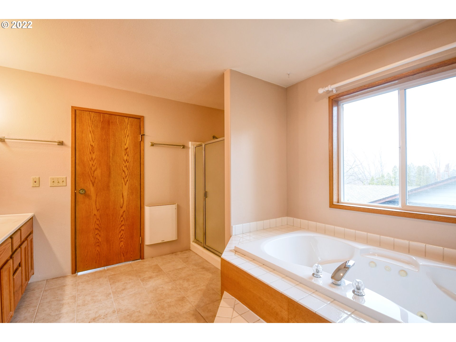 2011 Southwest Quinney Avenue Pendleton, OR 97801 - Photo 13 of 26 a bathroom with a tub shower and a sink