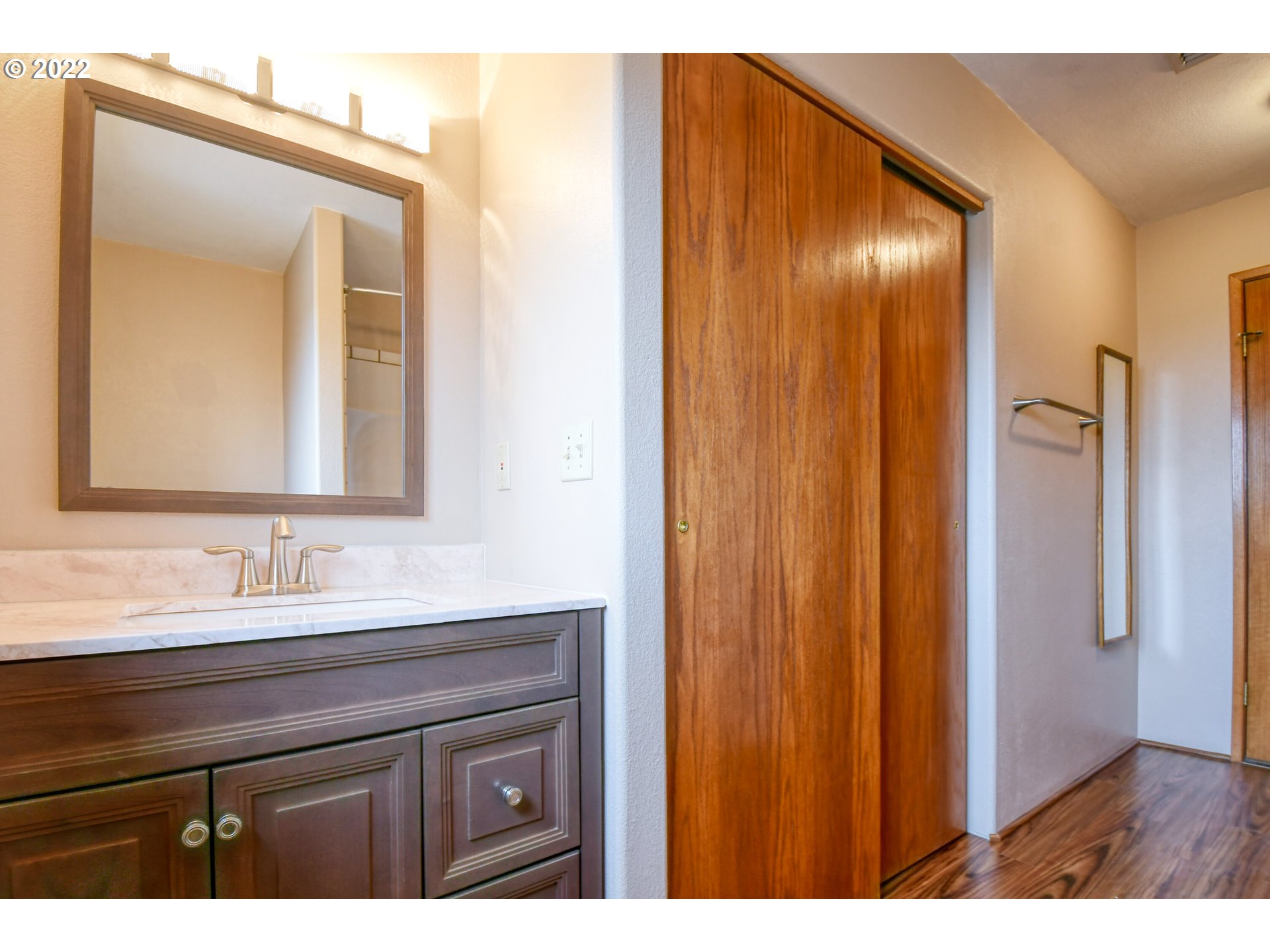 2011 Southwest Quinney Avenue Pendleton, OR 97801 - Photo 18 of 26 a bathroom with a double vanity sink and mirror