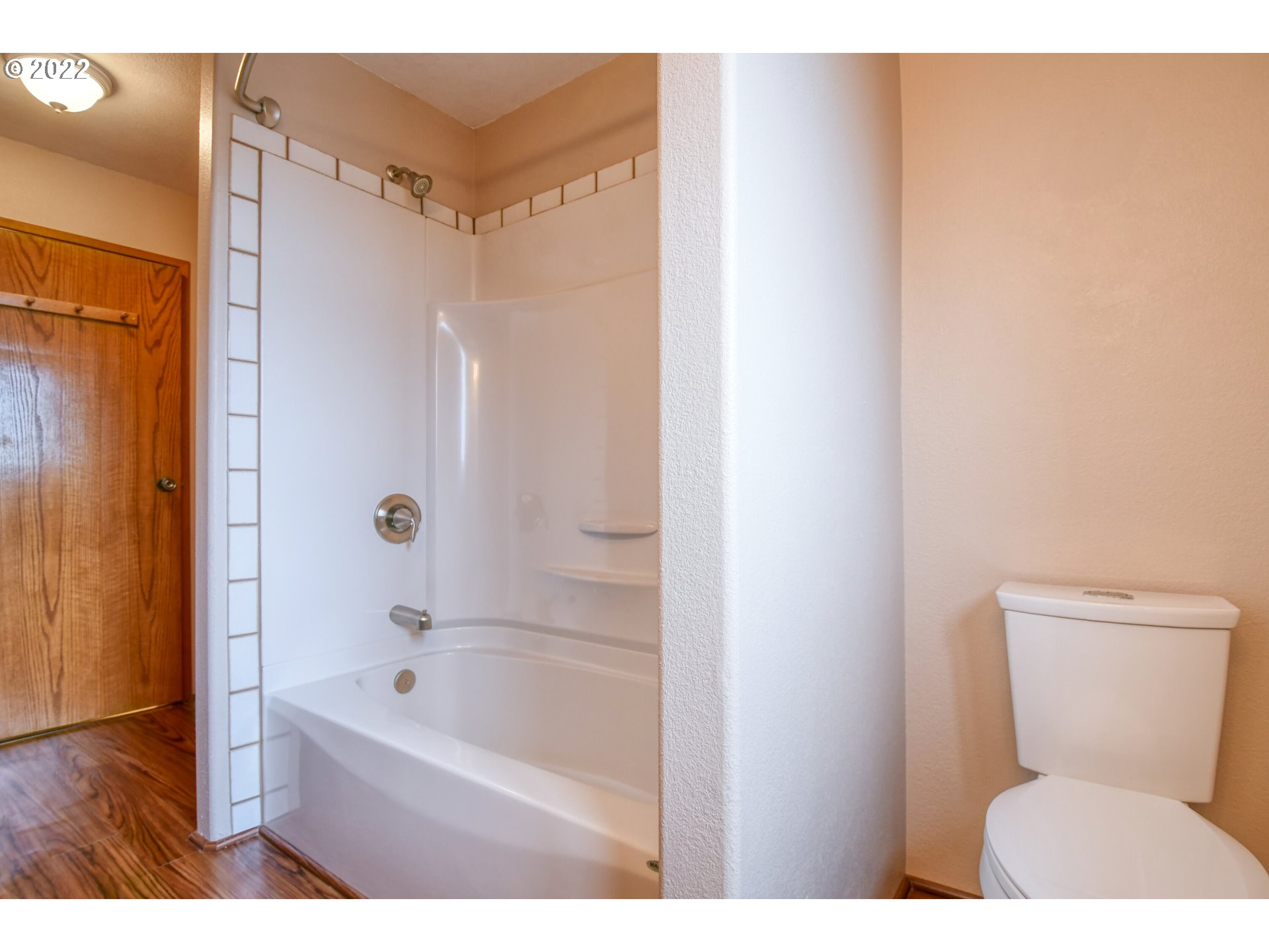 2011 Southwest Quinney Avenue Pendleton, OR 97801 - Photo 22 of 26 a bathroom with a toilet and a bathtub