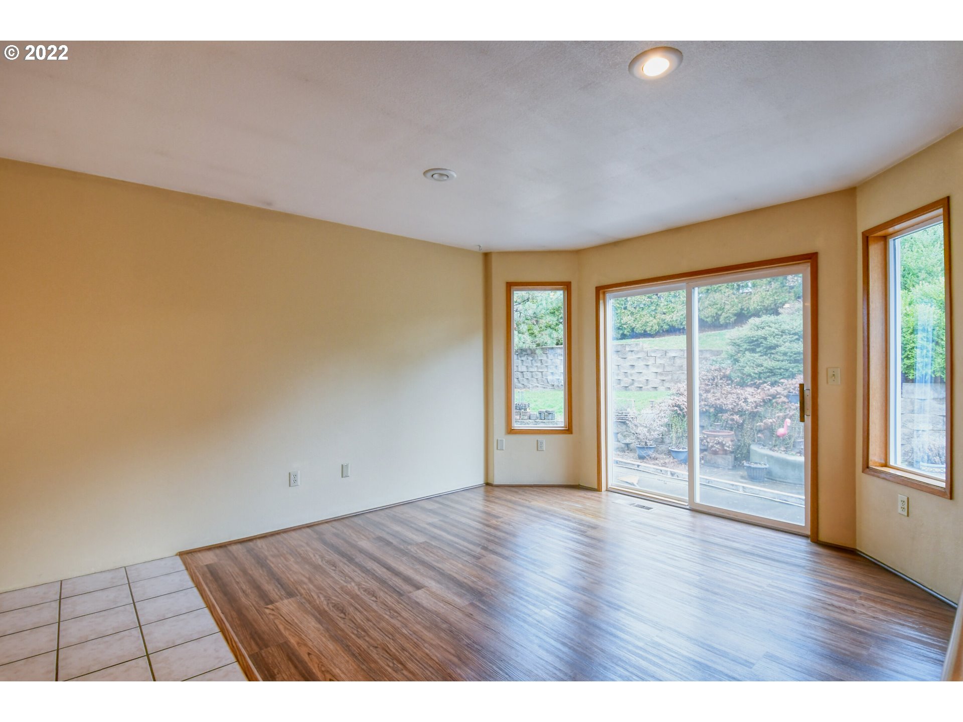 2011 Southwest Quinney Avenue Pendleton, OR 97801 - Photo 4 of 26 a view of an empty room with wooden floor and a window