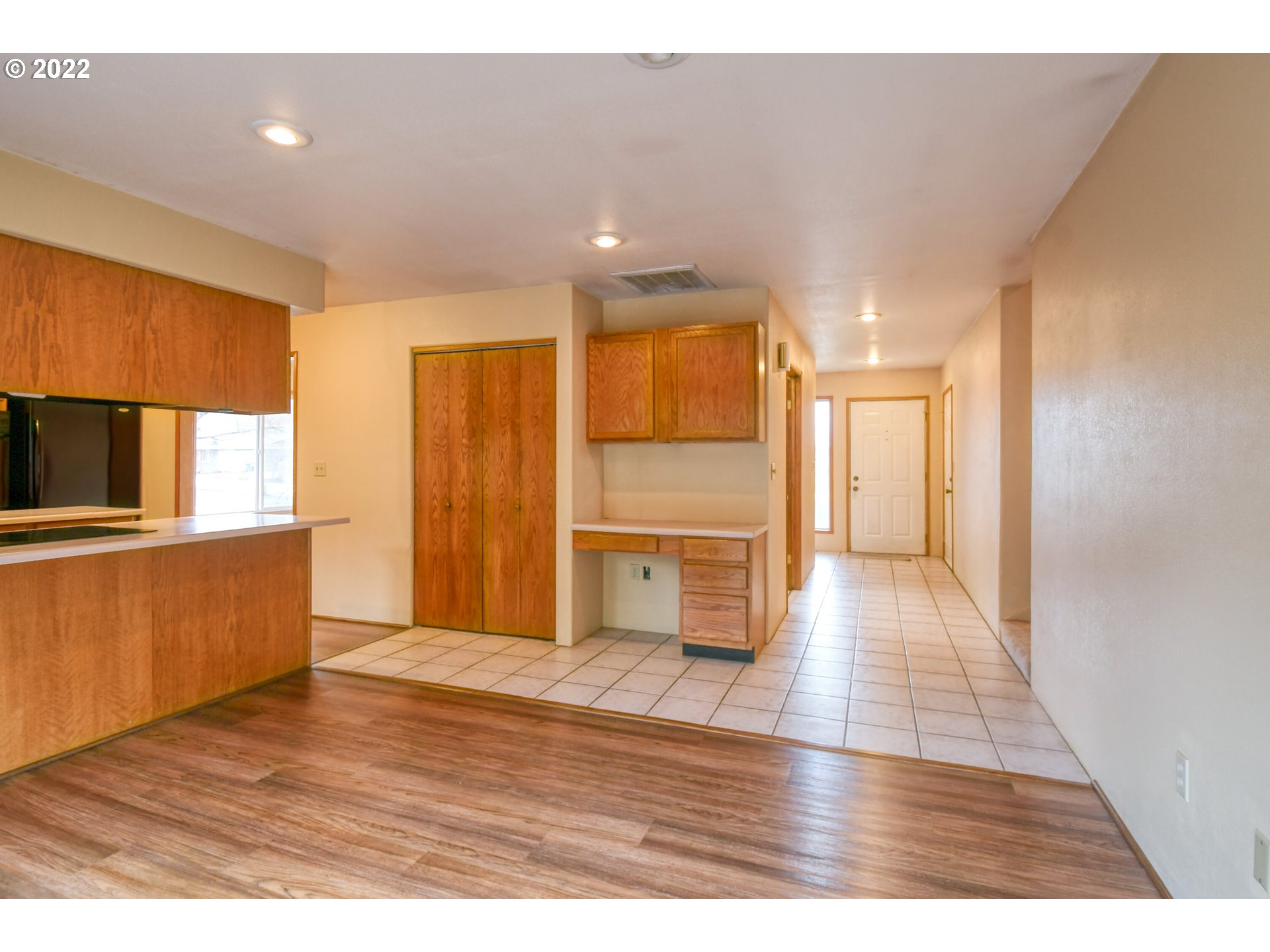 2011 Southwest Quinney Avenue Pendleton, OR 97801 - Photo 5 of 26 a view of a kitchen with wooden floor and a refrigerator