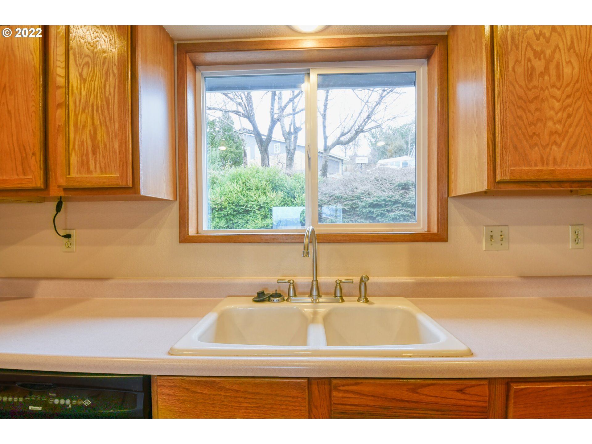 2011 Southwest Quinney Avenue Pendleton, OR 97801 - Photo 7 of 26 a bathroom with a sink and a large mirror