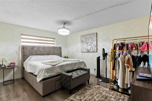 a bed room with a bed and a window