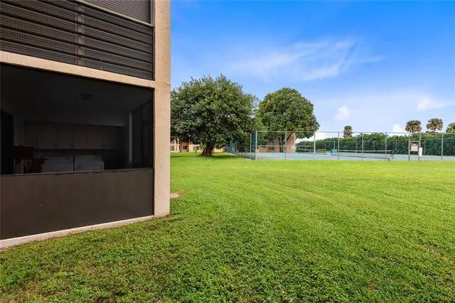 a backyard of a house with lots of green space