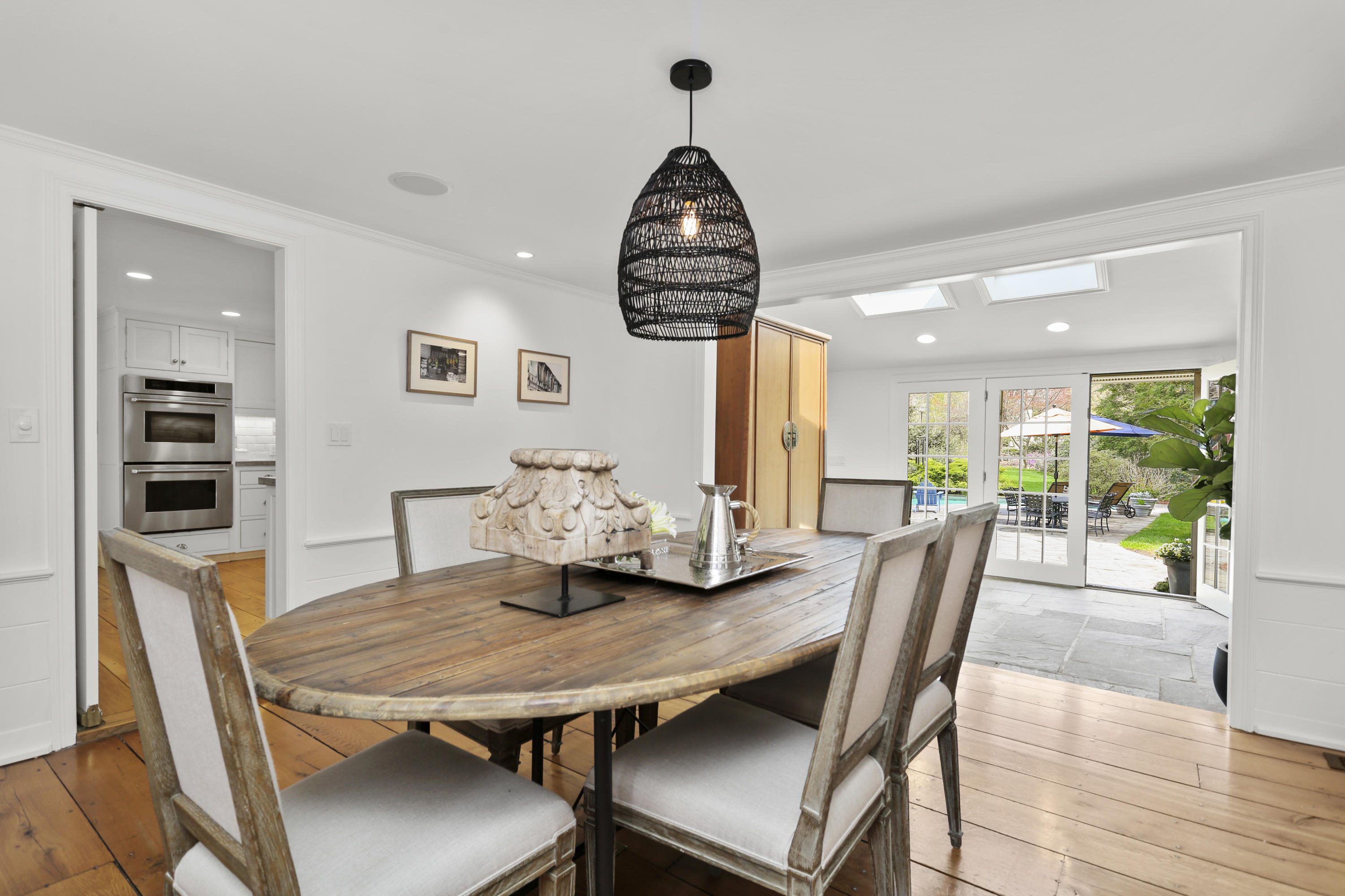 15 Old Farm Road Darien, CT 06820 - Photo 13 of 90 a dining room with furniture a chandelier and wooden floor