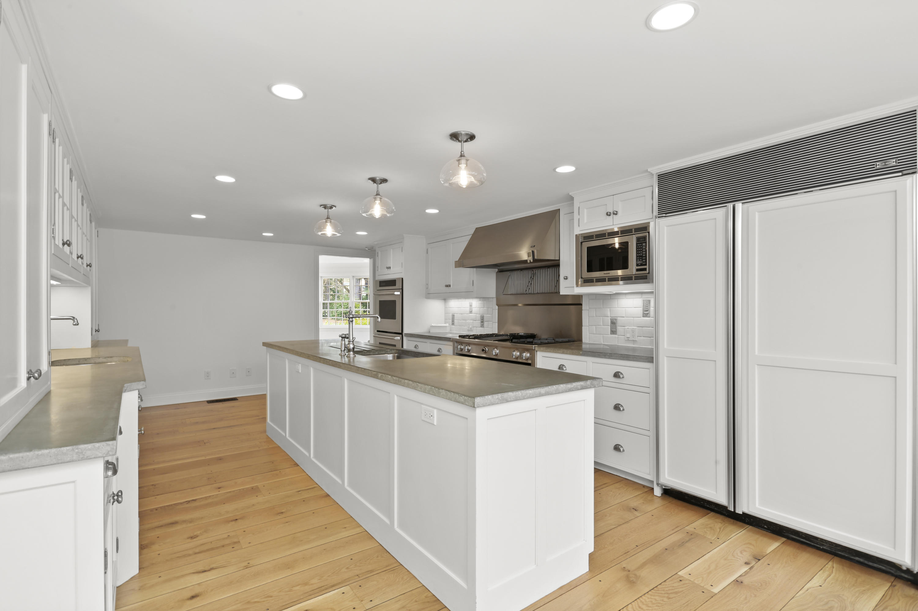 15 Old Farm Road Darien, CT 06820 - Photo 24 of 90 a kitchen with stainless steel appliances a refrigerator sink and microwave