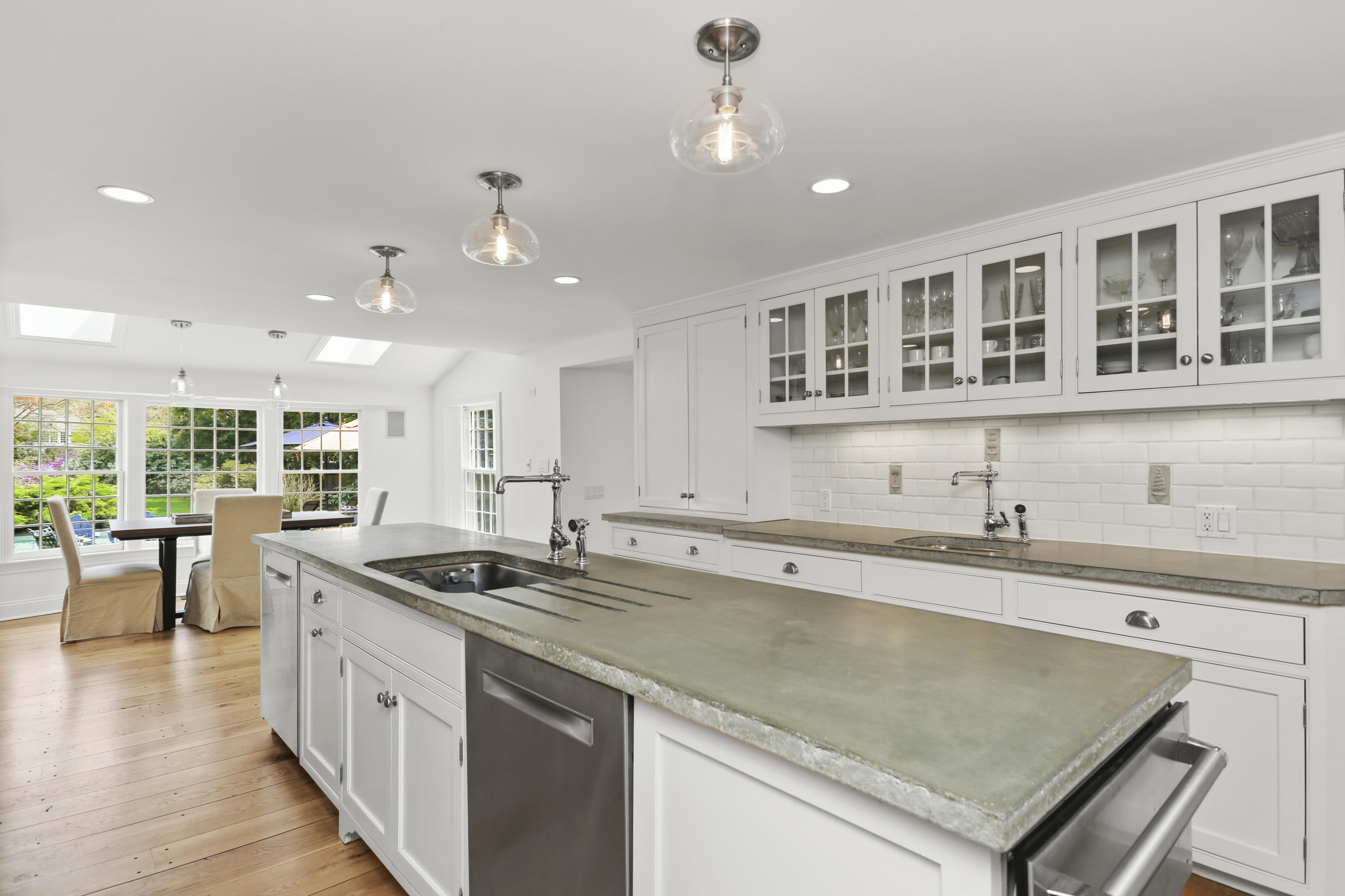 15 Old Farm Road Darien, CT 06820 - Photo 29 of 90 a kitchen with stainless steel appliances granite countertop a sink a stove and a wooden floors