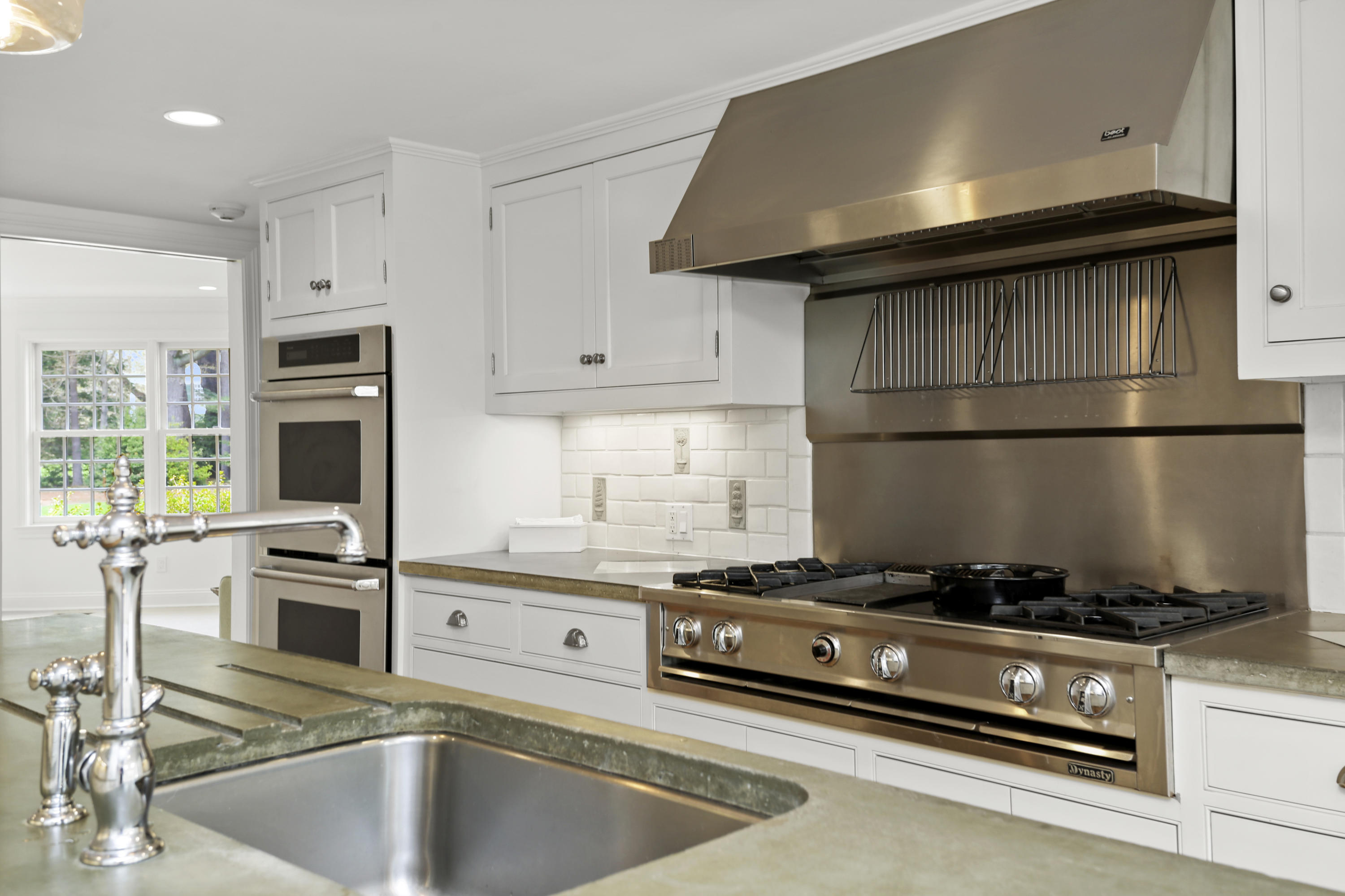 15 Old Farm Road Darien, CT 06820 - Photo 30 of 90 a kitchen with stainless steel appliances granite countertop a stove and a refrigerator