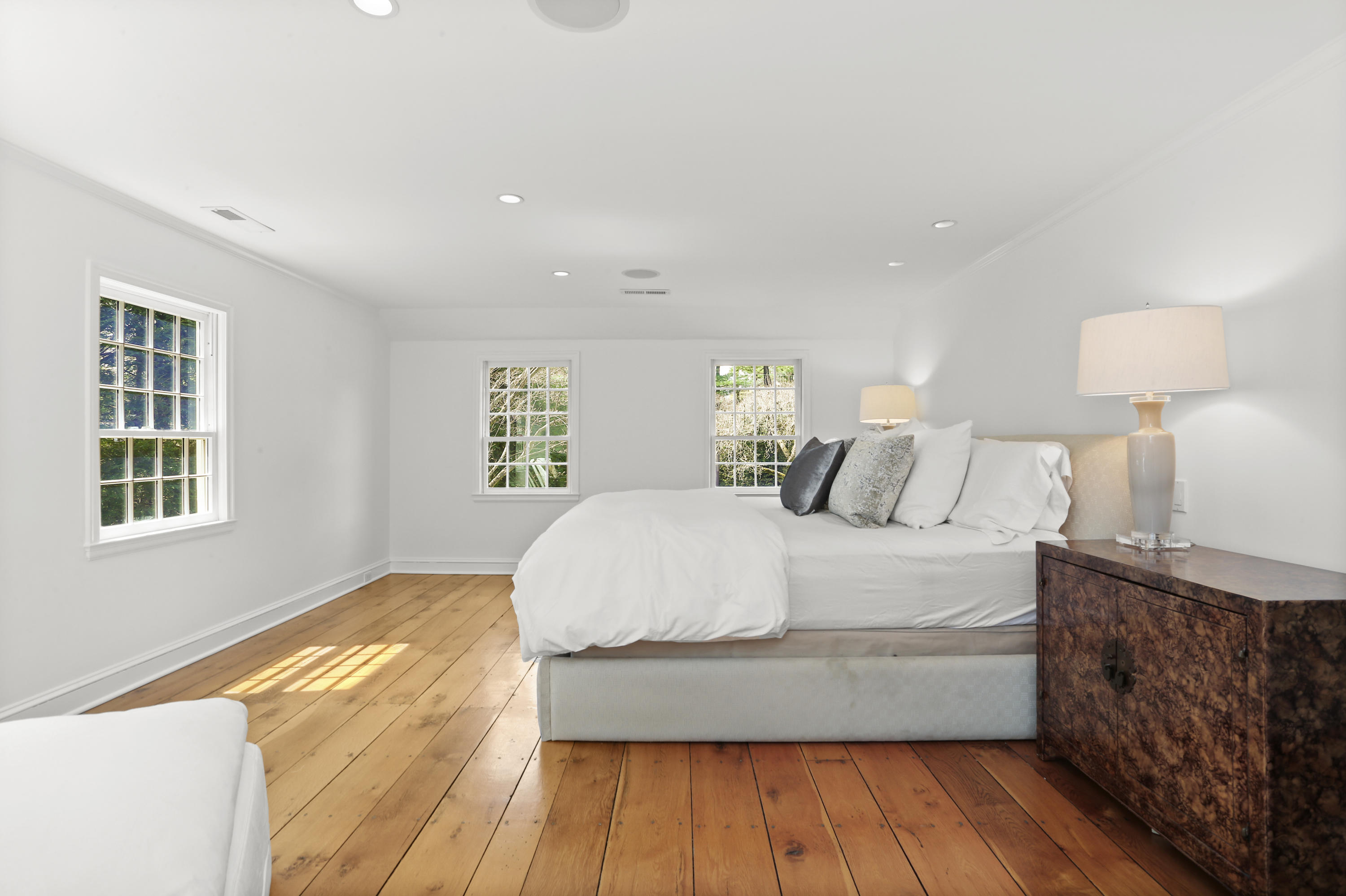 15 Old Farm Road Darien, CT 06820 - Photo 37 of 90 a large bed sitting in a bedroom next to a window