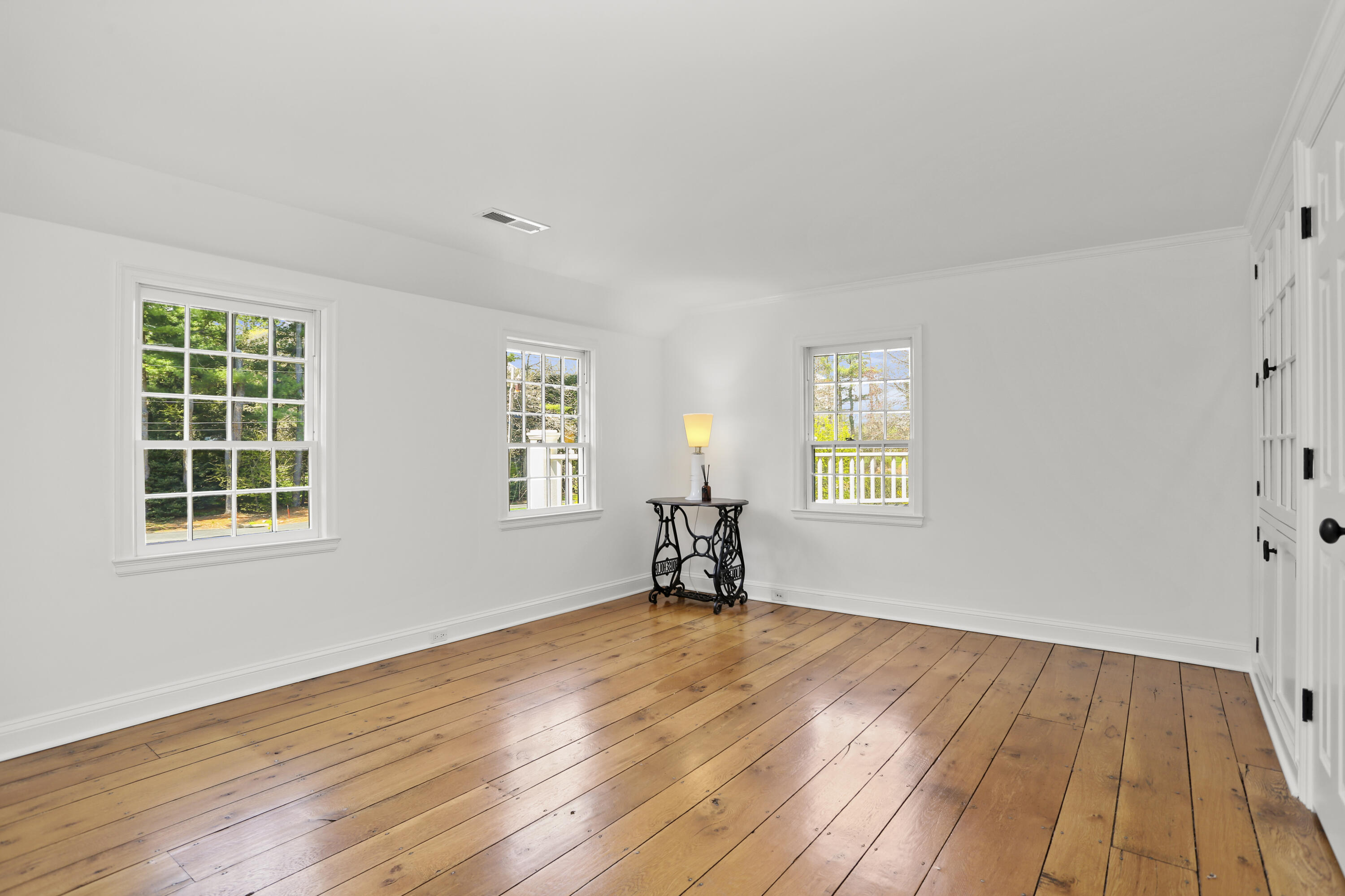 15 Old Farm Road Darien, CT 06820 - Photo 45 of 90 a view of empty room with wooden floor and fan