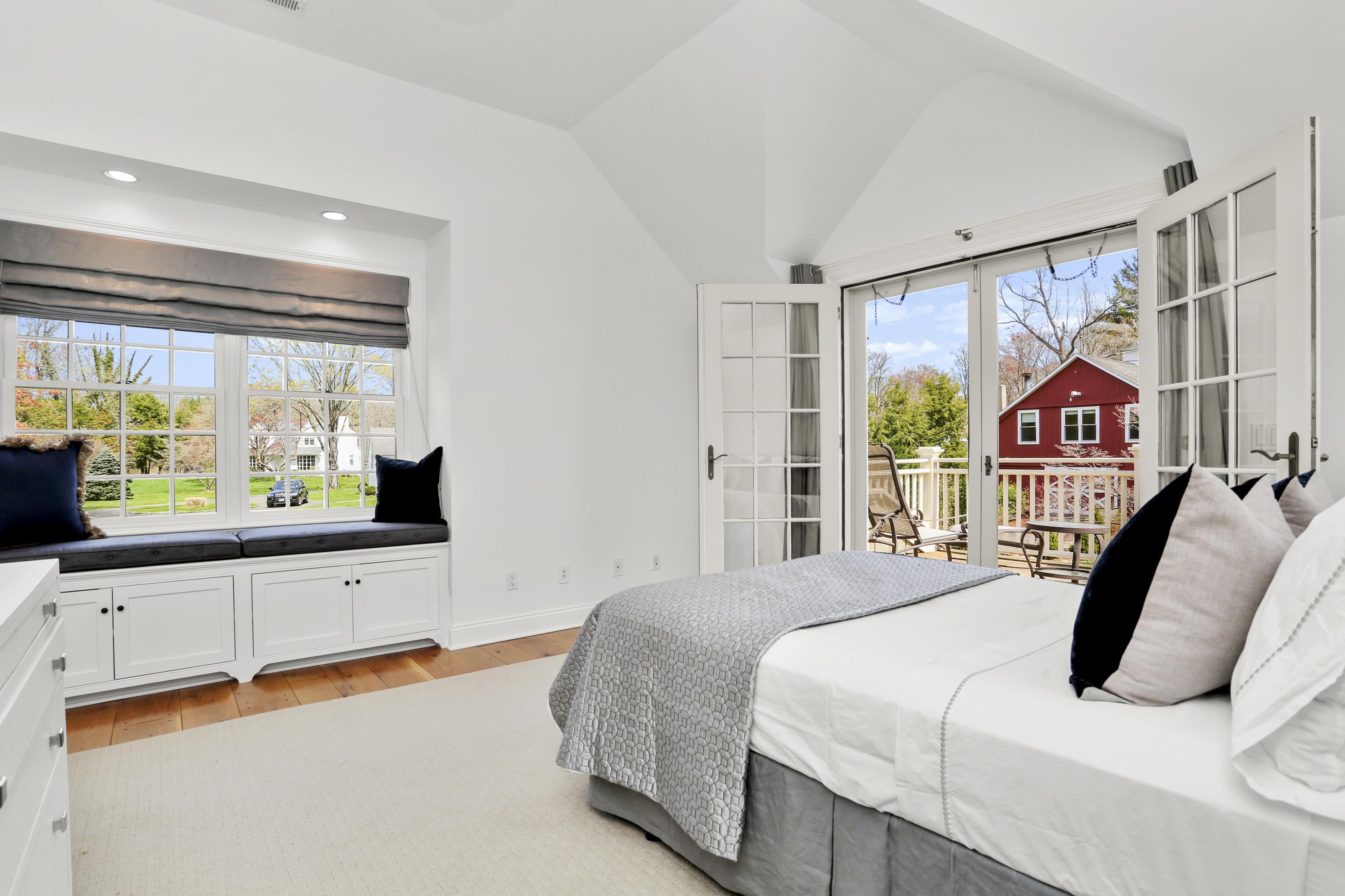 15 Old Farm Road Darien, CT 06820 - Photo 50 of 90 a bedroom with a bed and a flat tv screen on dresser