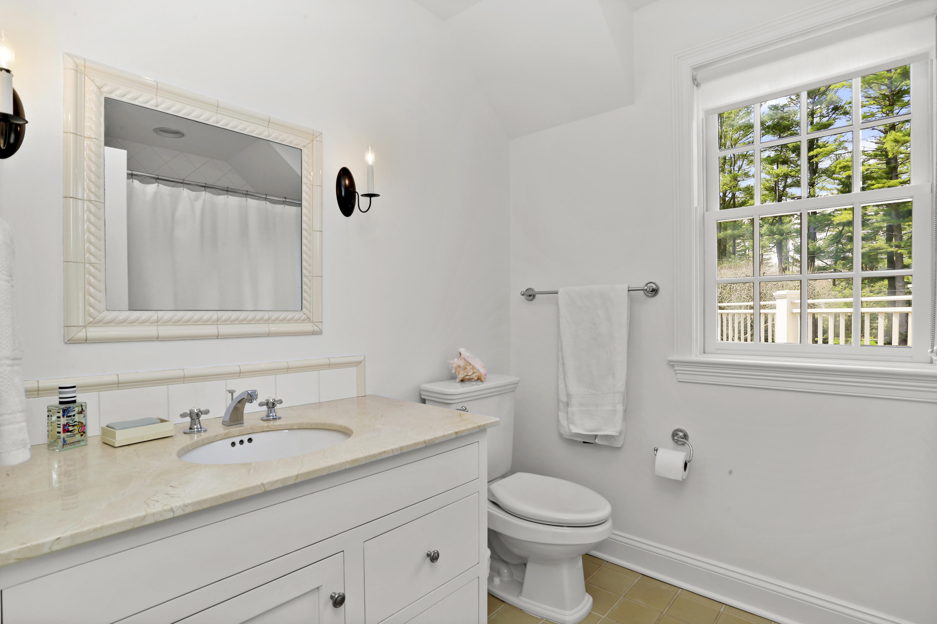 15 Old Farm Road Darien, CT 06820 - Photo 53 of 90 a bathroom with a granite countertop sink a toilet and a mirror