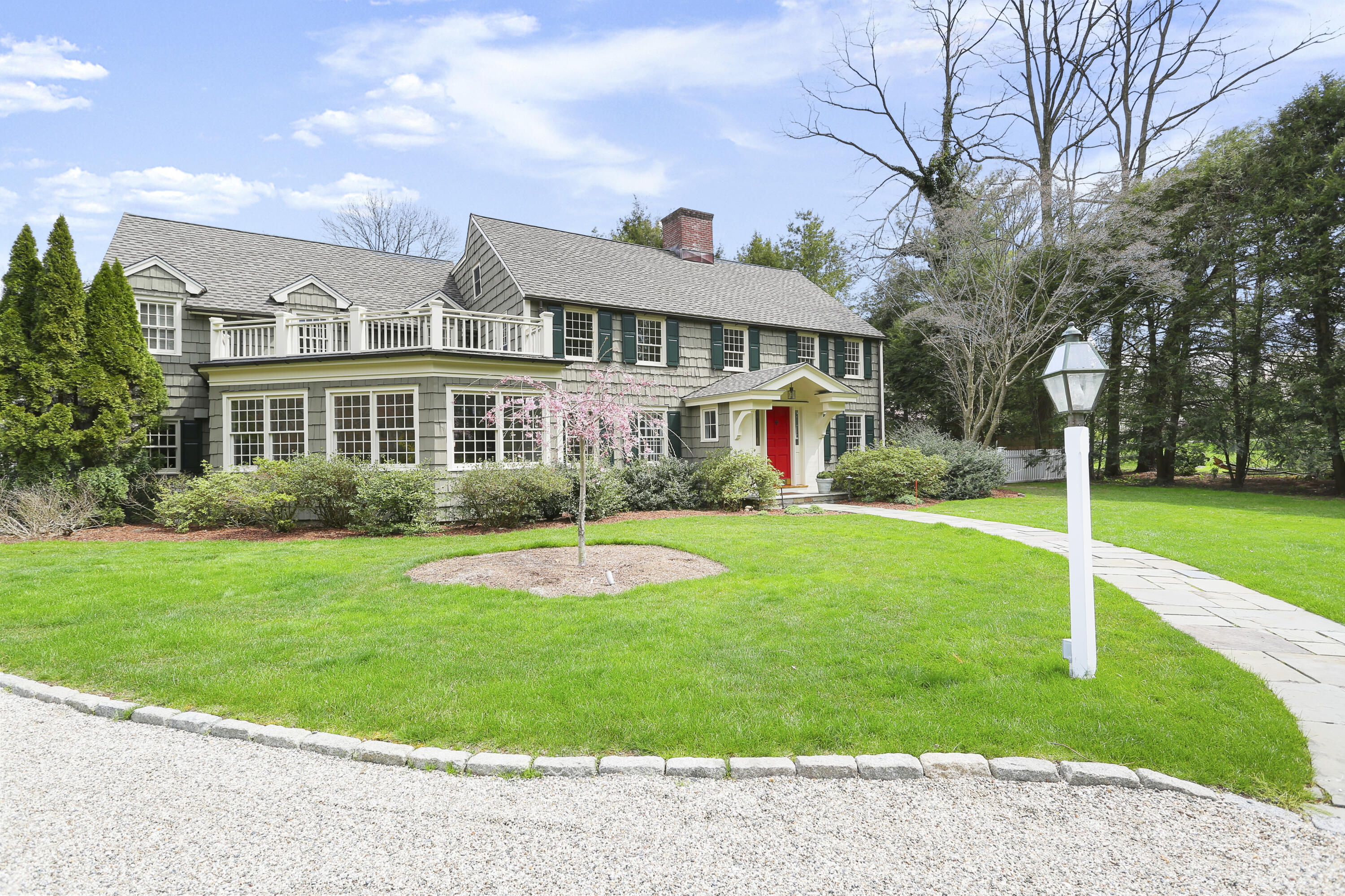 15 Old Farm Road Darien, CT 06820 - Photo 81 of 90 a front view of a house with a yard table and chairs