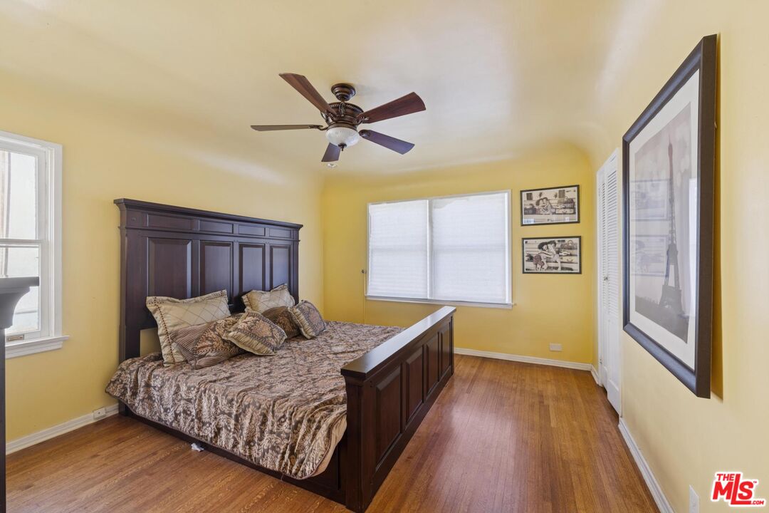 5002 Valley Ridge Avenue View Park, CA 90043 - Photo 19 of 44 a bed room with a bed and a window