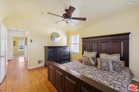 a bathroom with a glass door shower and a sink