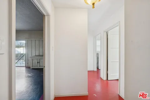 a view of a livingroom with furniture and hardwood floor
