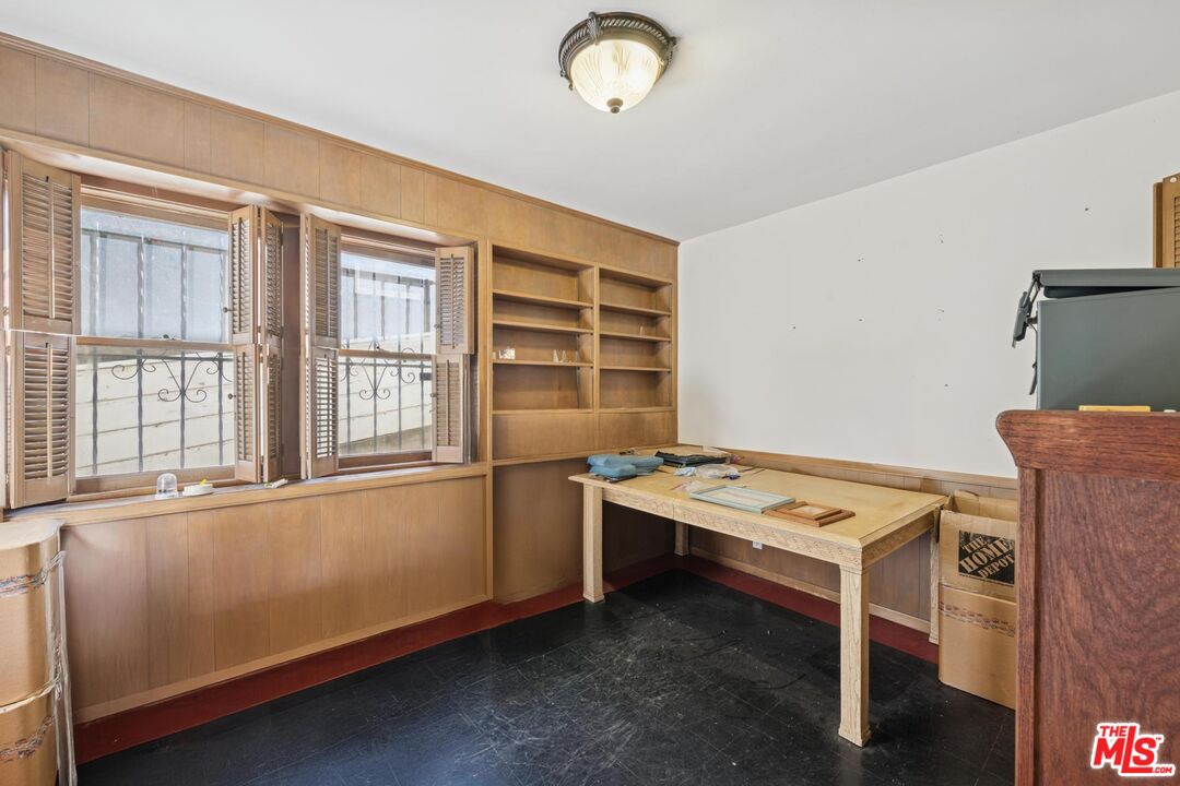 5002 Valley Ridge Avenue View Park, CA 90043 - Photo 31 of 44 a room with furniture and a window