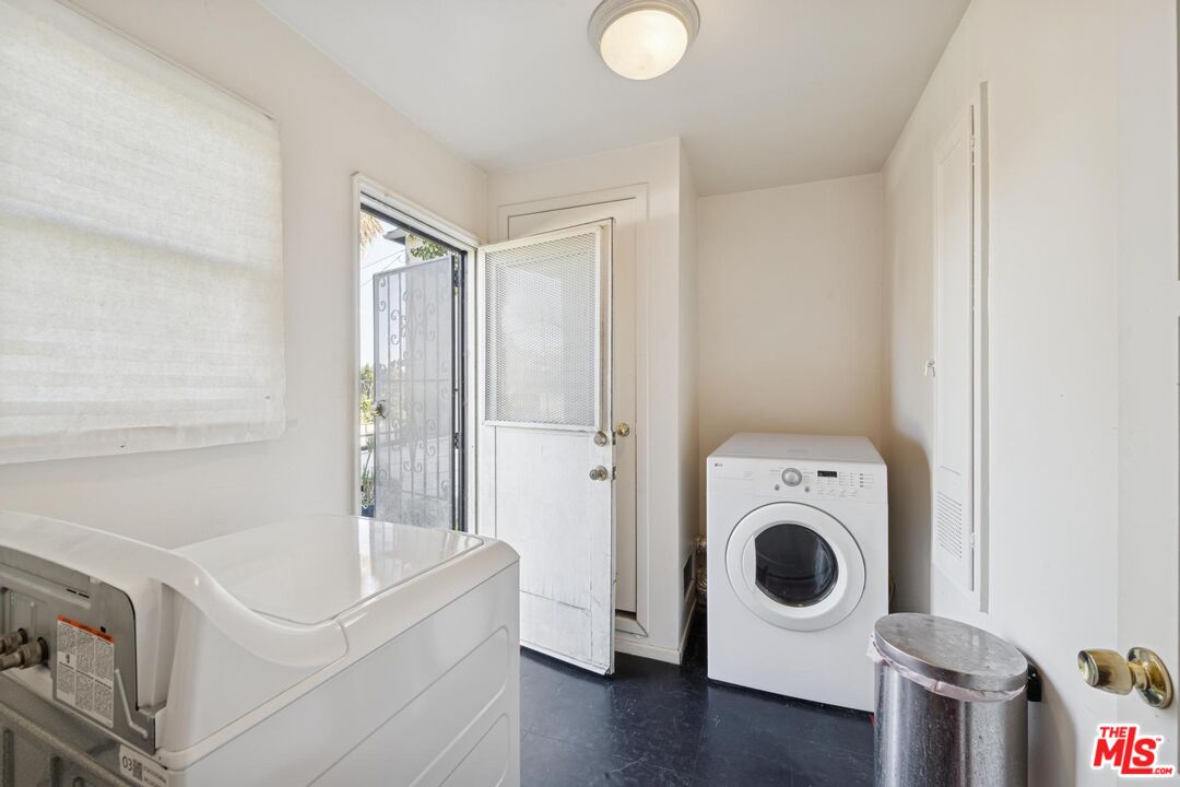 5002 Valley Ridge Avenue View Park, CA 90043 - Photo 33 of 44 a utility room with dryer and washer