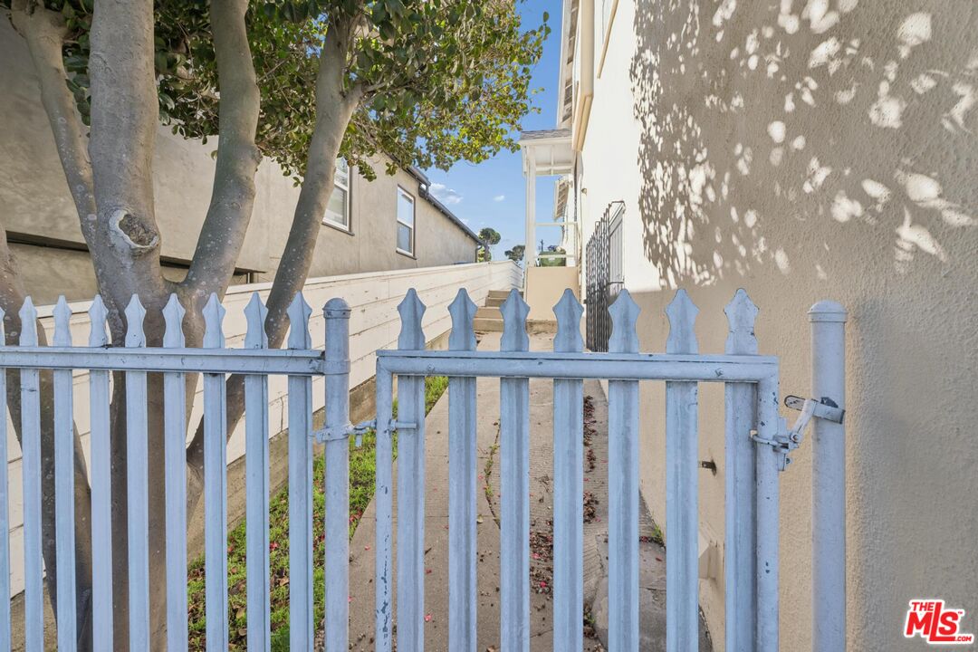 5002 Valley Ridge Avenue View Park, CA 90043 - Photo 34 of 44 a view of stairs with wooden fence and floor