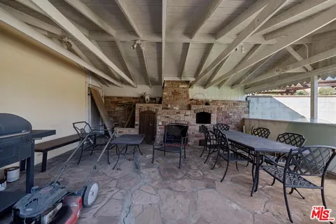 a view of a garden with sitting area