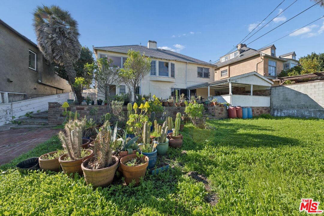 5002 Valley Ridge Avenue View Park, CA 90043 - Photo 39 of 44 a view of a house with garden and yard