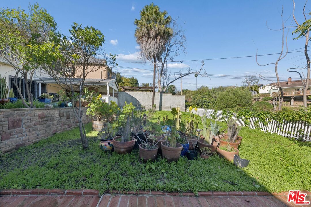 5002 Valley Ridge Avenue View Park, CA 90043 - Photo 40 of 44 a view of a chair and table in backyard