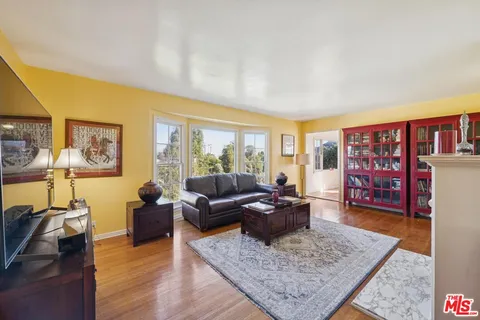 a living room with furniture and a rug