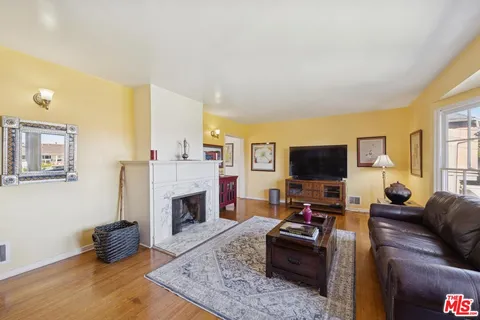 a living room with furniture and a fireplace or television