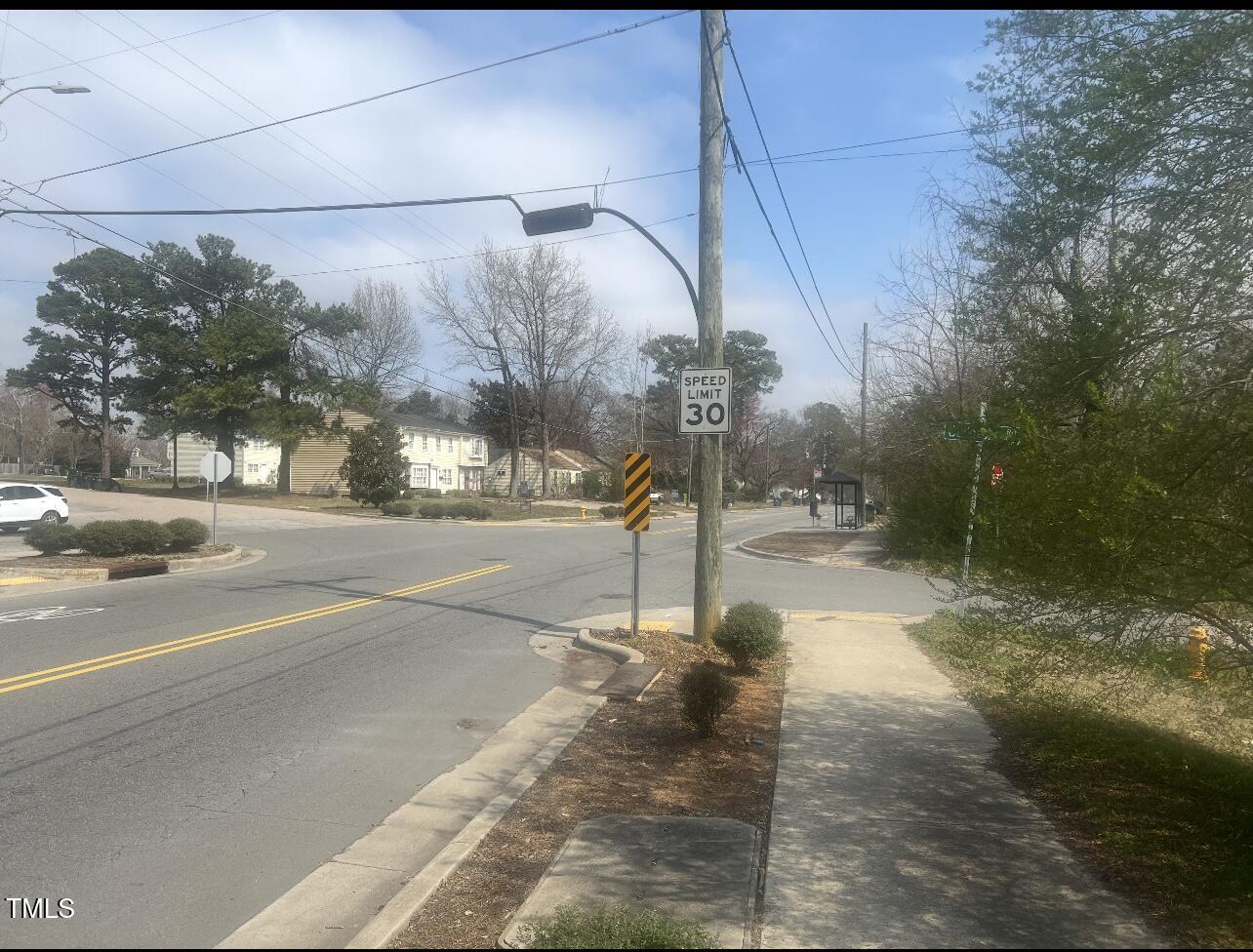 2040 Milburnie Road Raleigh, NC 27610 - Photo 2 of 8 a sign board with yard in the back