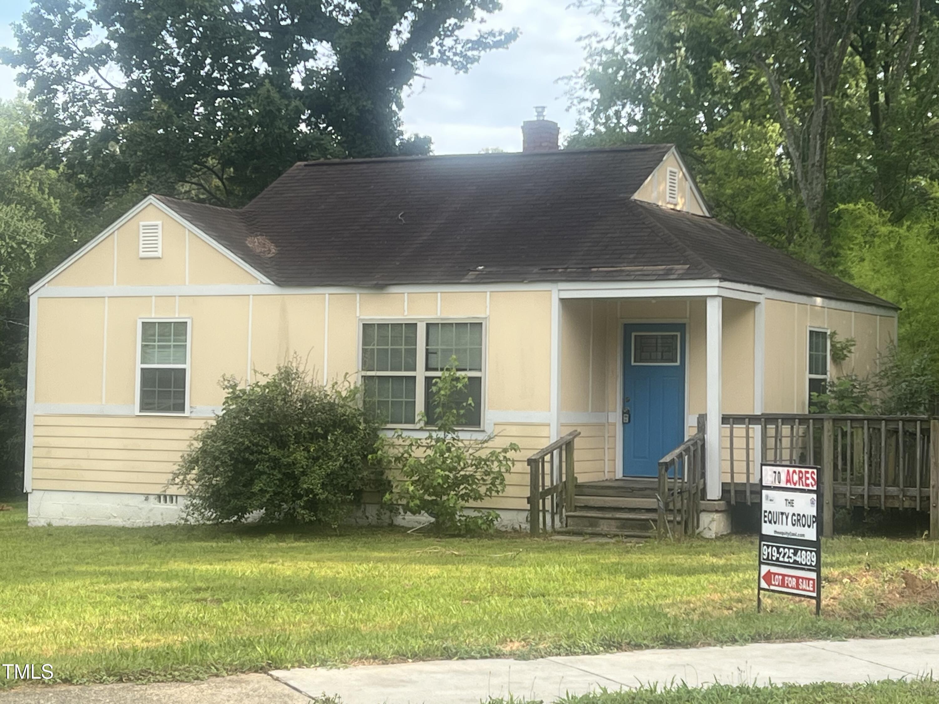 2040 Milburnie Road Raleigh, NC 27610 - Photo 6 of 8 a front view of a house with a yard