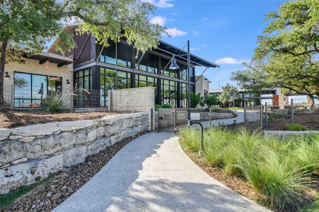 a view of a backyard with sitting area