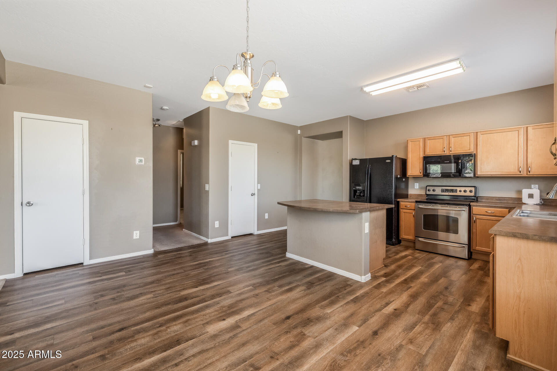 3148 West Maldonado Road Phoenix, AZ 85041 - Photo 12 of 31 a view of kitchen with sink microwave and refrigerator