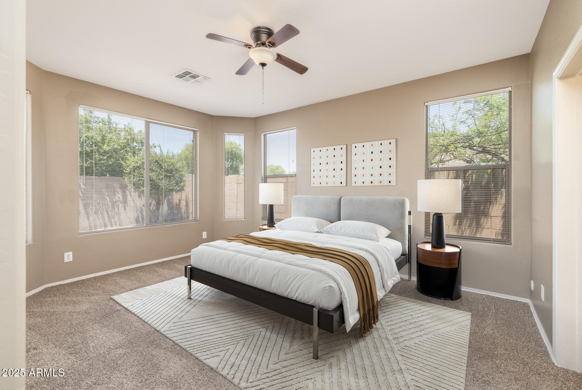 3148 West Maldonado Road Phoenix, AZ 85041 - Photo 17 of 31 a bedroom with a large bed and a window
