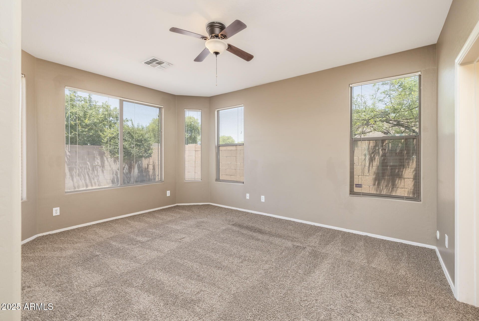 3148 West Maldonado Road Phoenix, AZ 85041 - Photo 18 of 31 a view of an empty room with a window