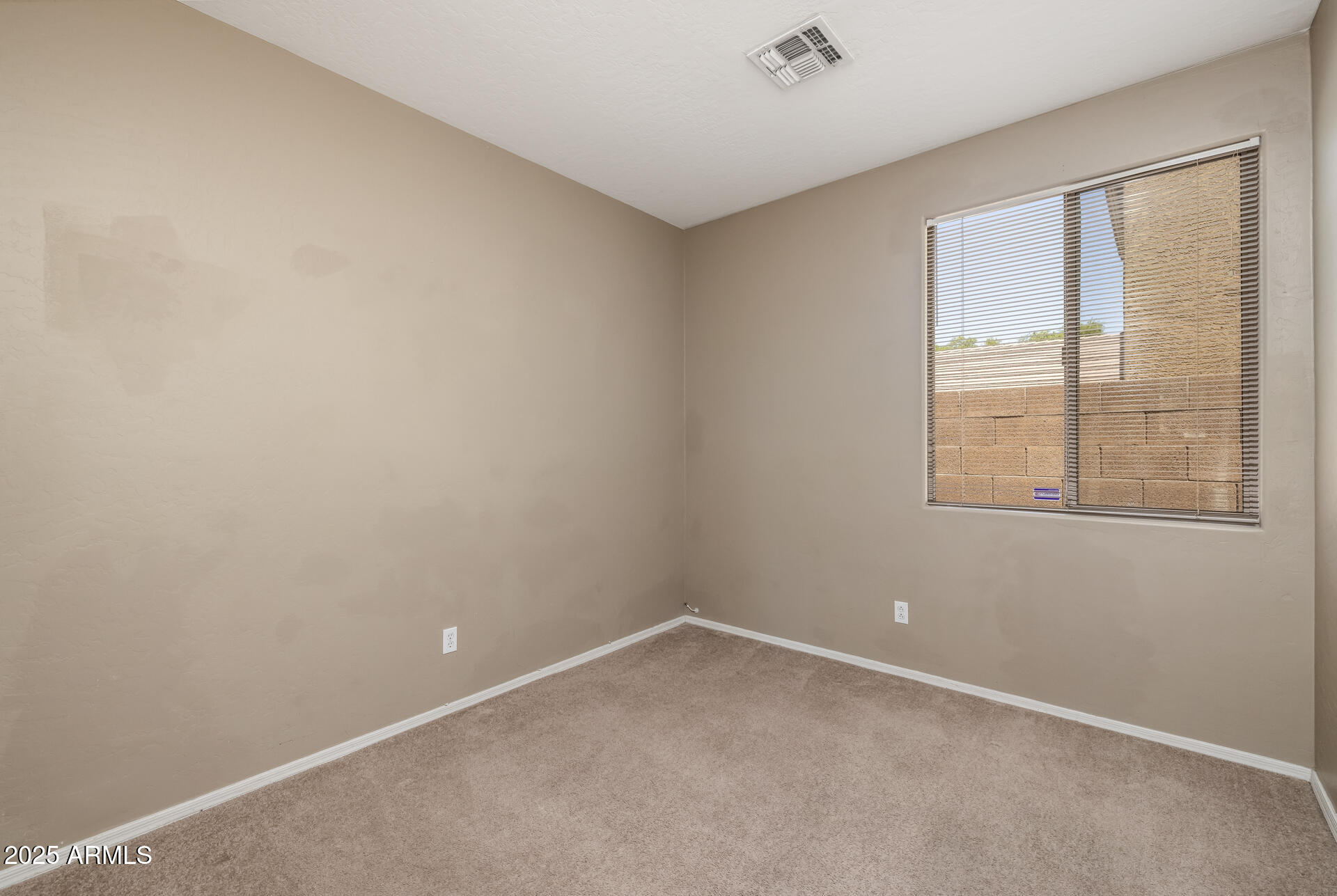3148 West Maldonado Road Phoenix, AZ 85041 - Photo 22 of 31 an empty room with windows