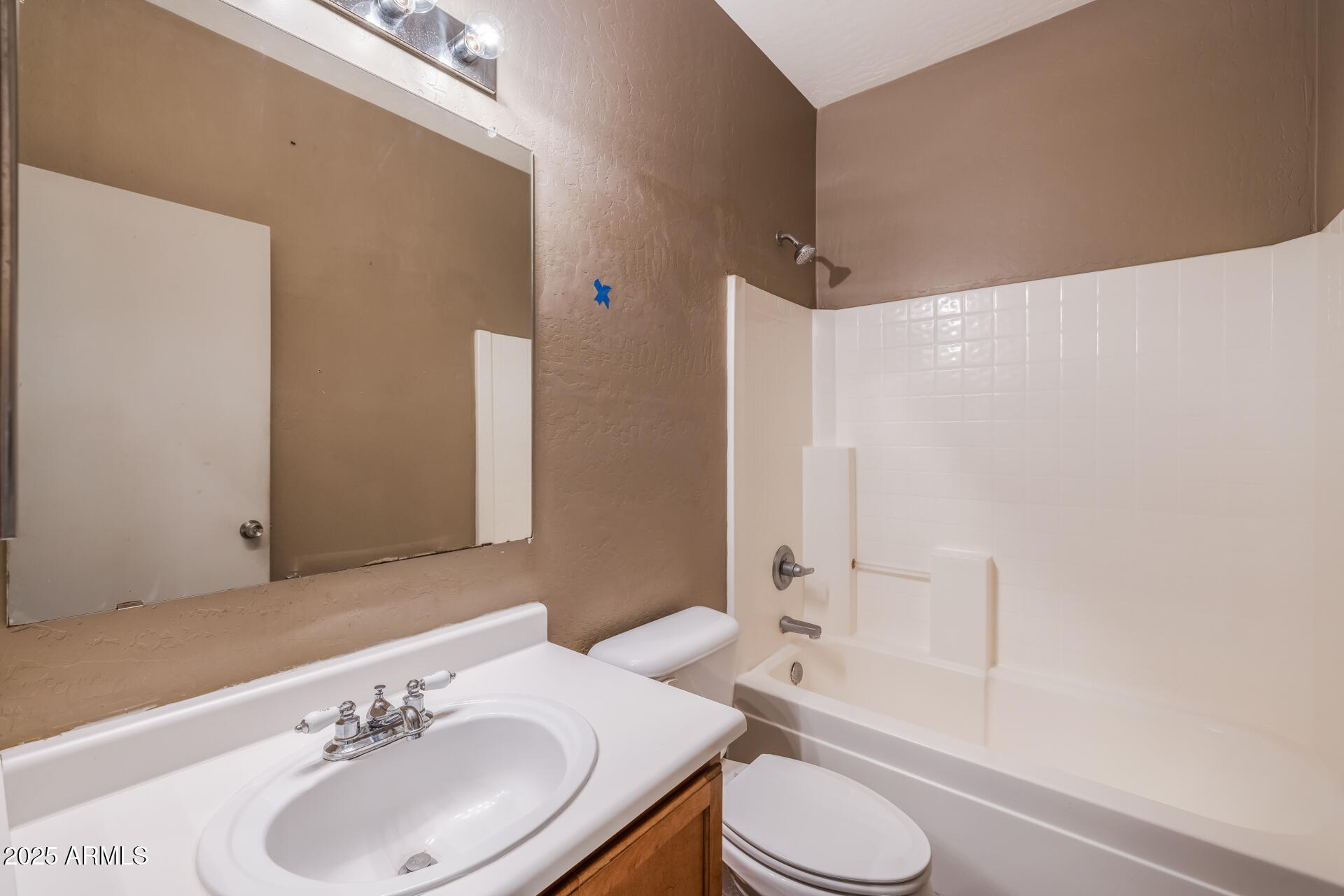 3148 West Maldonado Road Phoenix, AZ 85041 - Photo 23 of 31 a bathroom with a sink toilet and shower