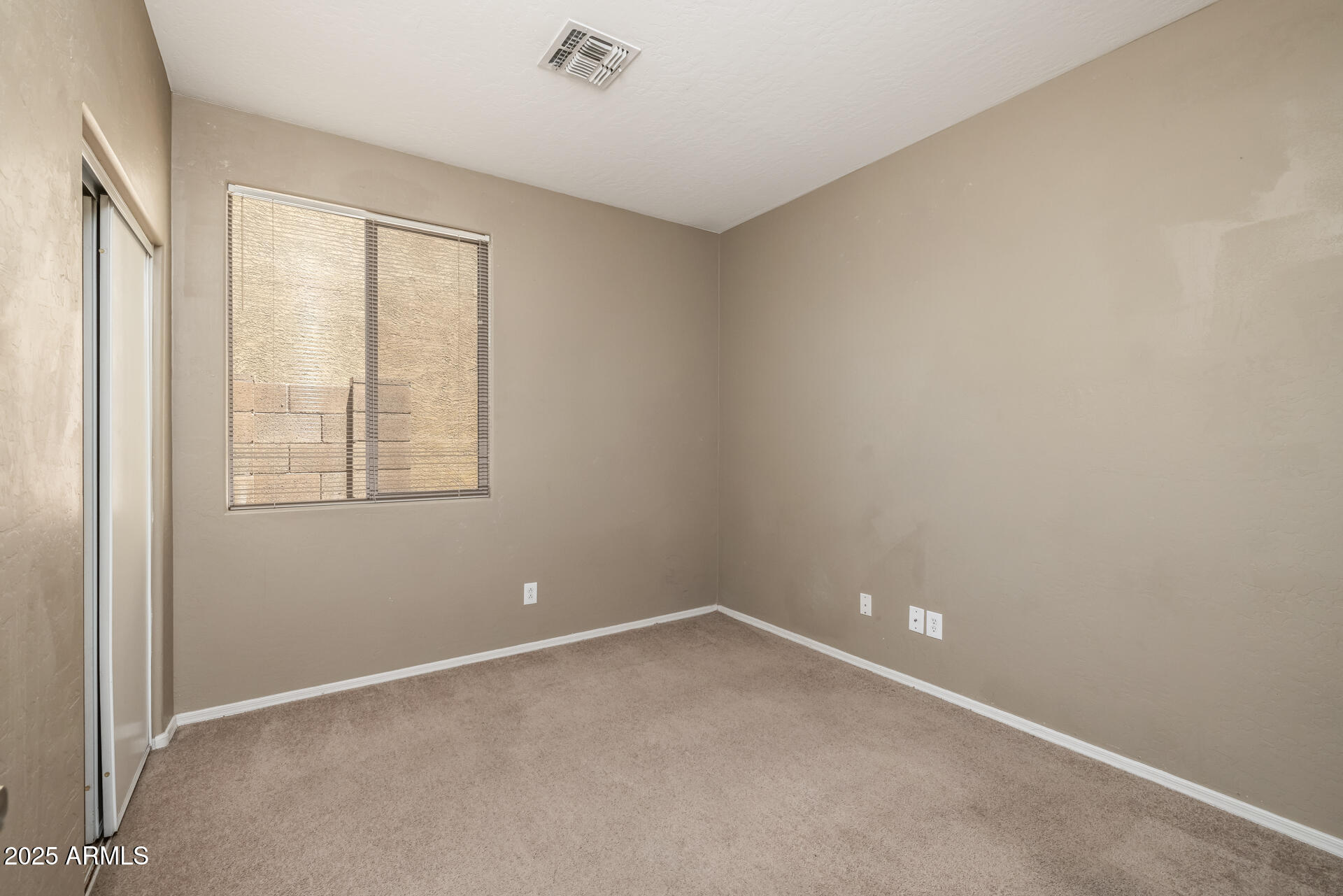 3148 West Maldonado Road Phoenix, AZ 85041 - Photo 24 of 31 an empty room with windows
