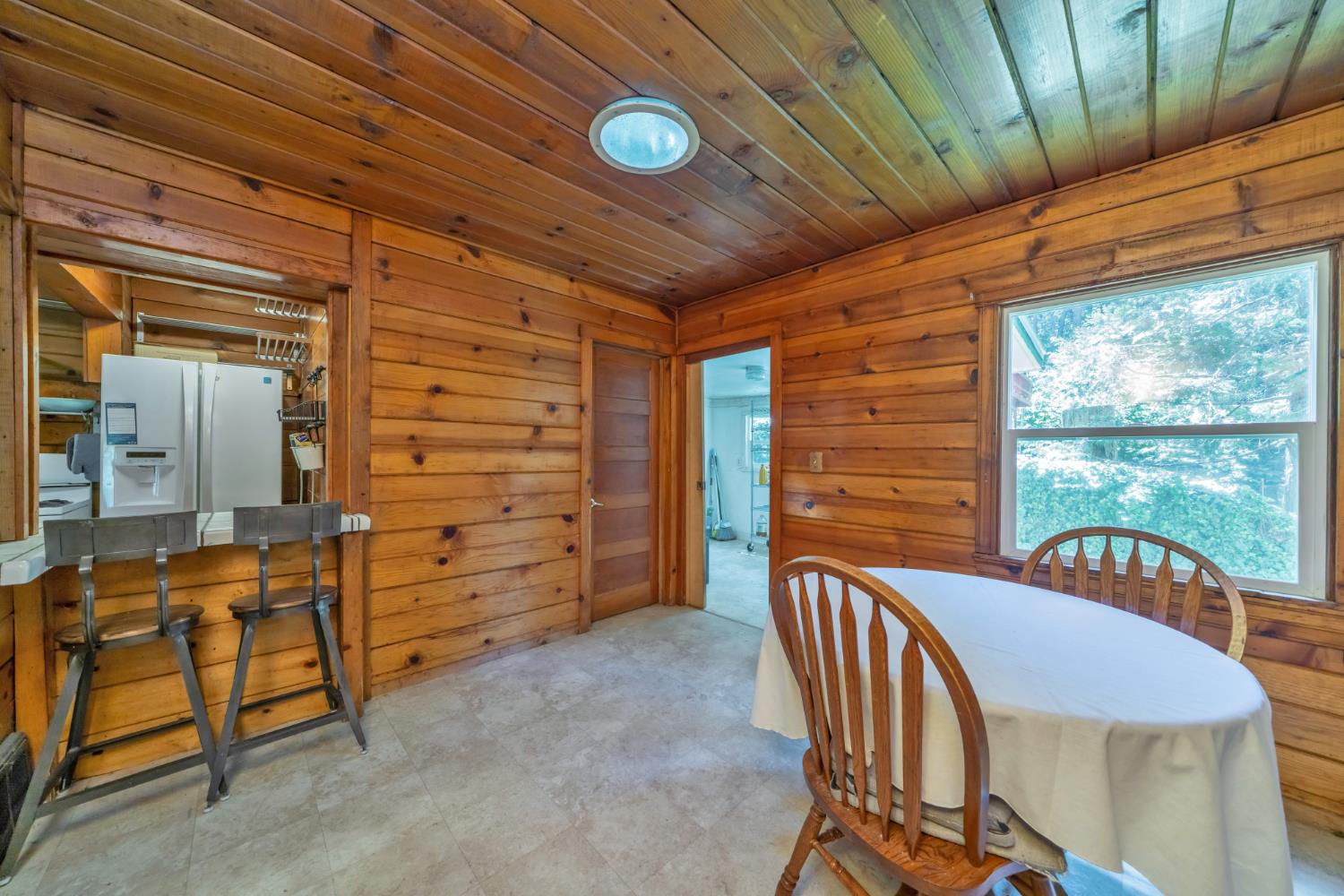 6929 Split Bend Road Pollock Pines, CA 95726 - Photo 16 of 38 a balcony with table and chairs