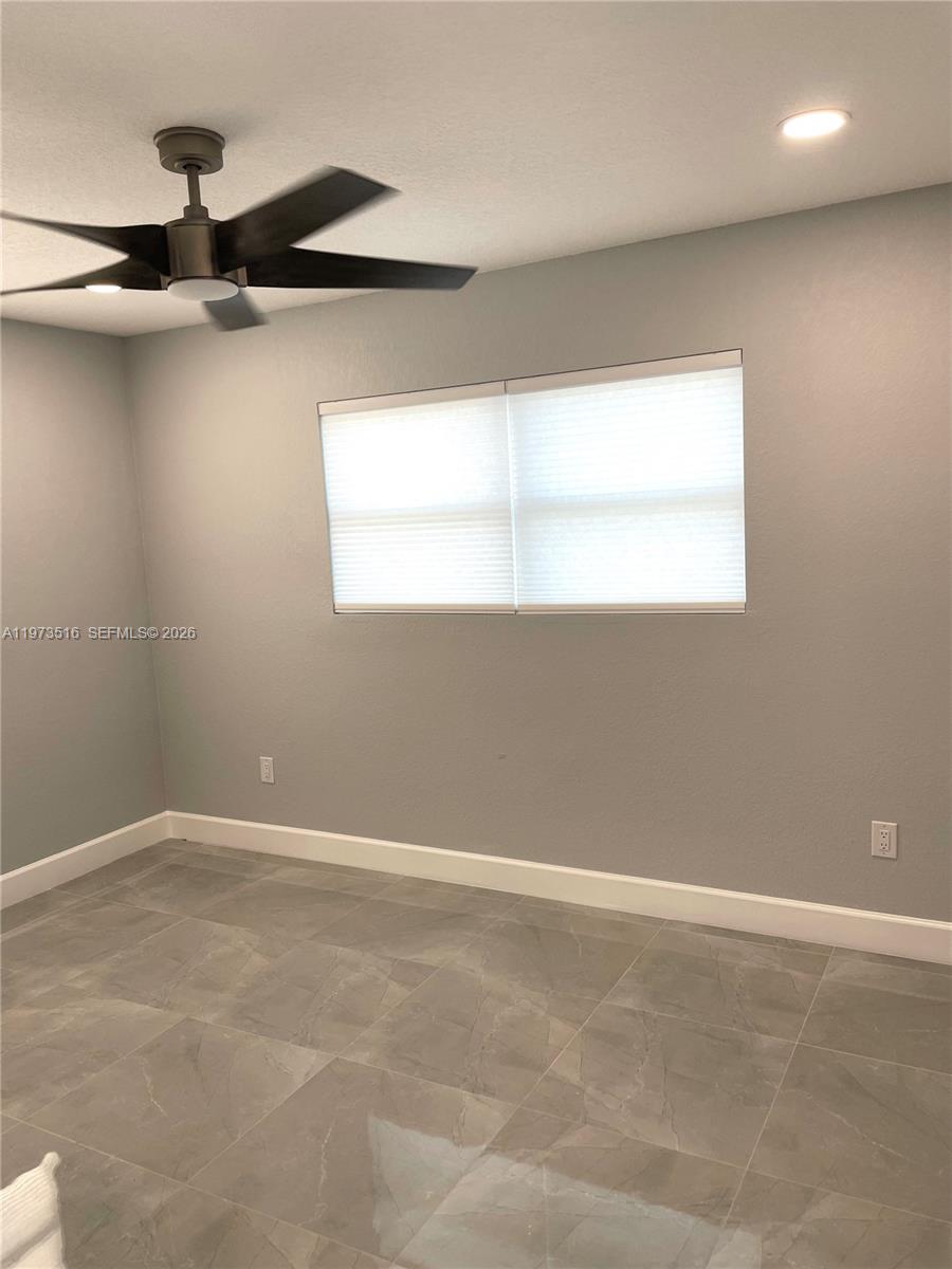 1280 West Camino Real, Unit 1280 Boca Raton, FL 33486 - Photo 12 of 26 en empty room with windows