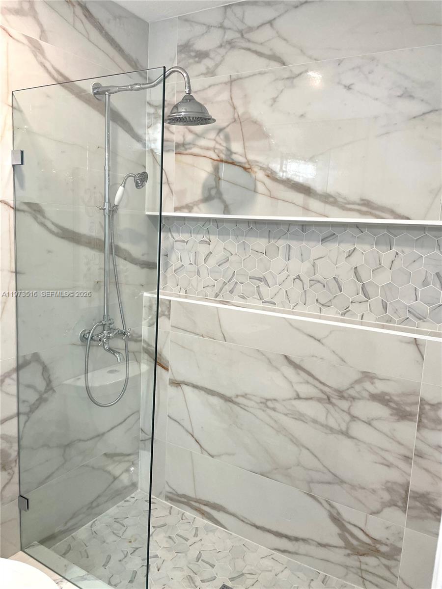 1280 West Camino Real, Unit 1280 Boca Raton, FL 33486 - Photo 13 of 26 a bathroom with a shower